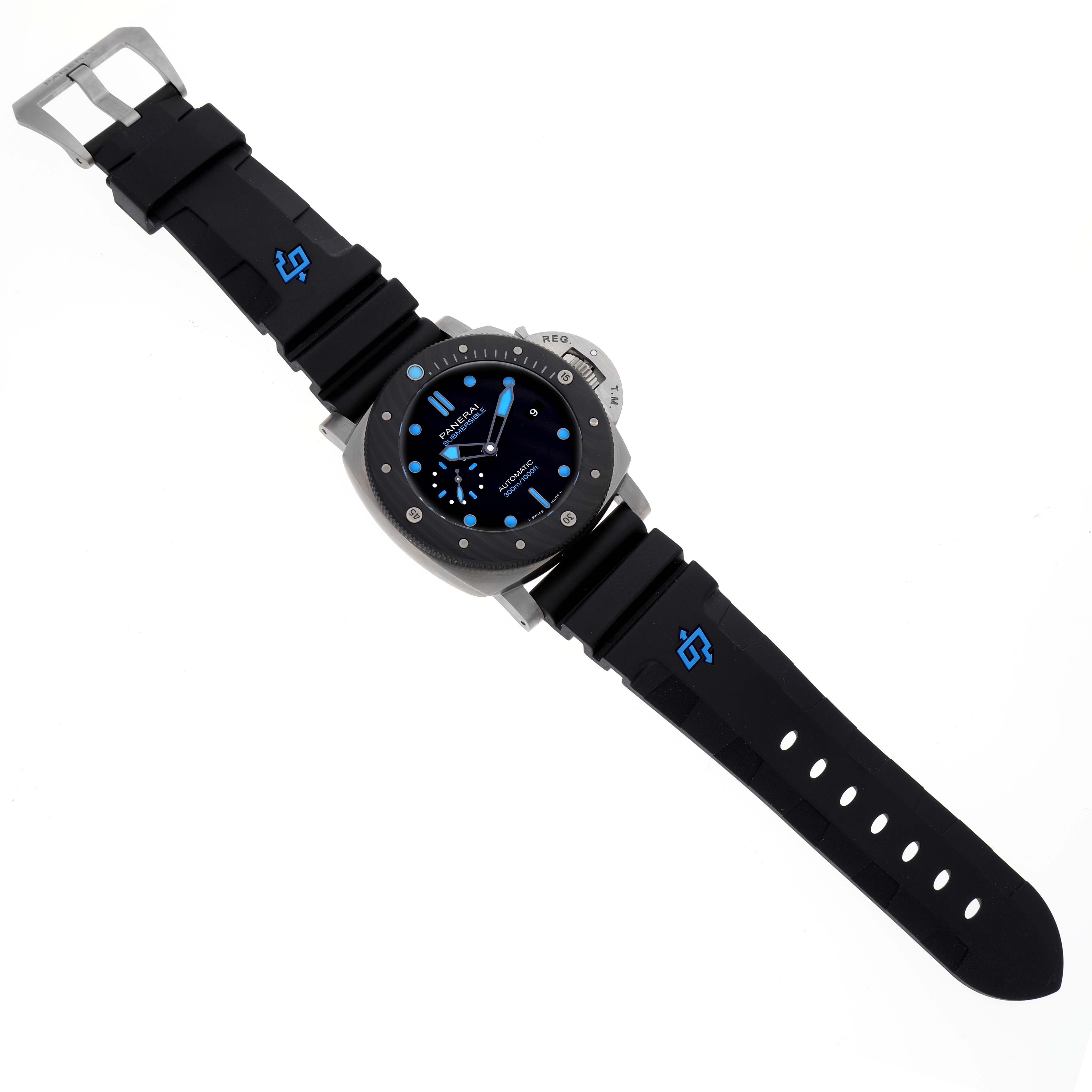 The Panerai Submersible PAM00799 Mens Titanium Black Dial watch is shown from a top-down angle, displaying its face, bezel, and strap with blue accents.
