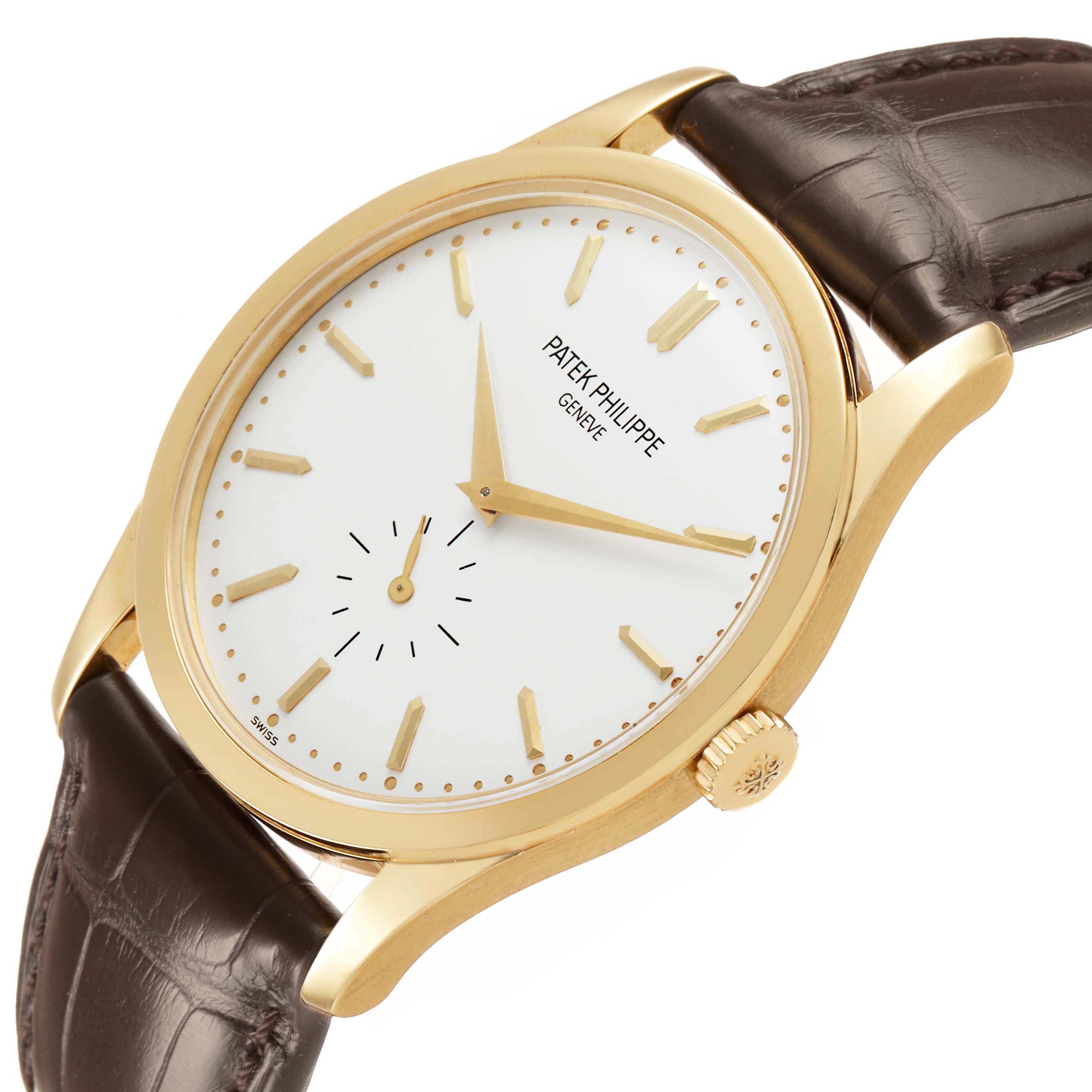 The image shows a Patek Philippe Calatrava 5196J Men's Yellow Gold Silver Dial watch angled to display the dial, case, crown, and leather strap from a slight side view.