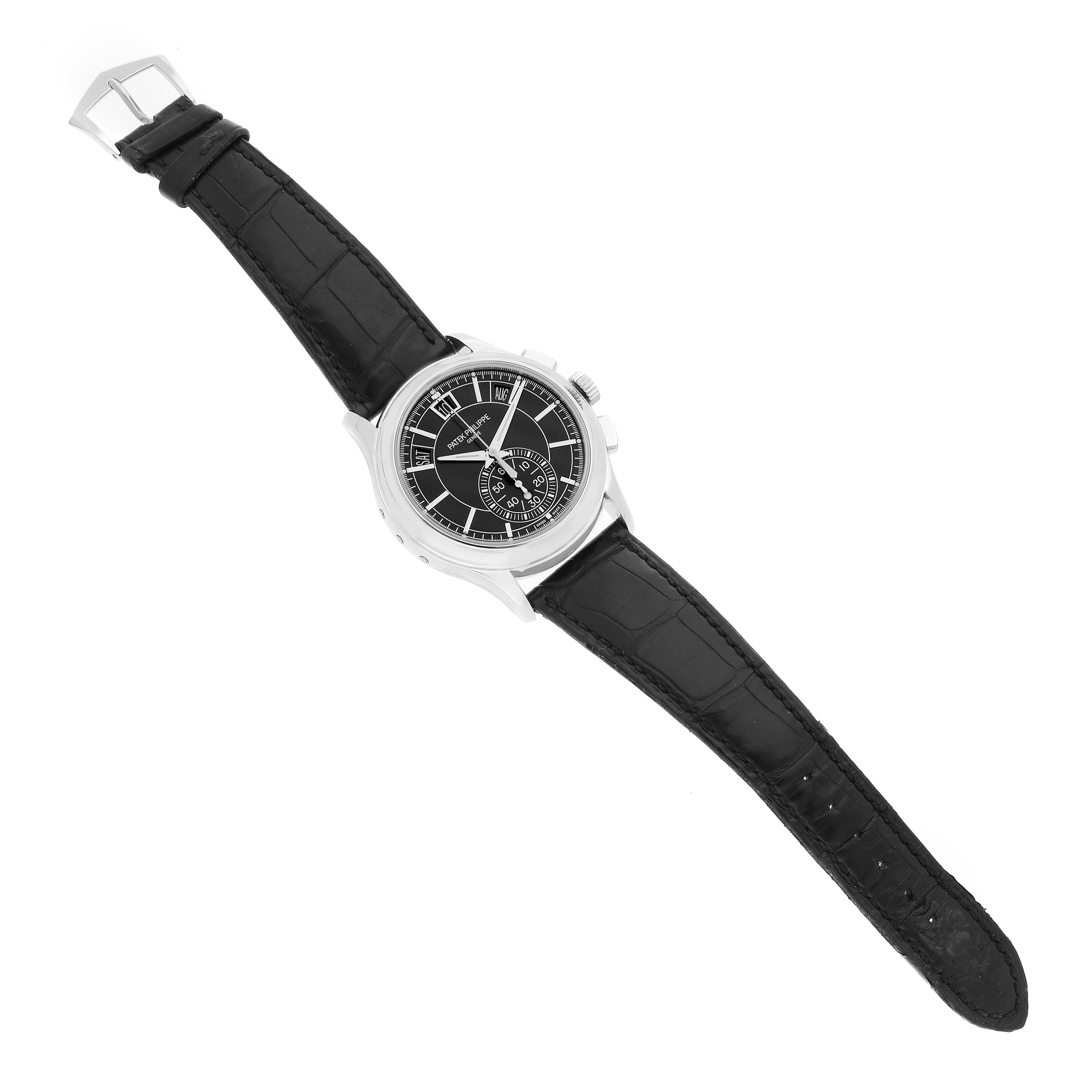The Patek Philippe Complications 5905 Men's Platinum Black Dial watch is shown from a top-down angle, displaying its black leather strap and detailed black dial.