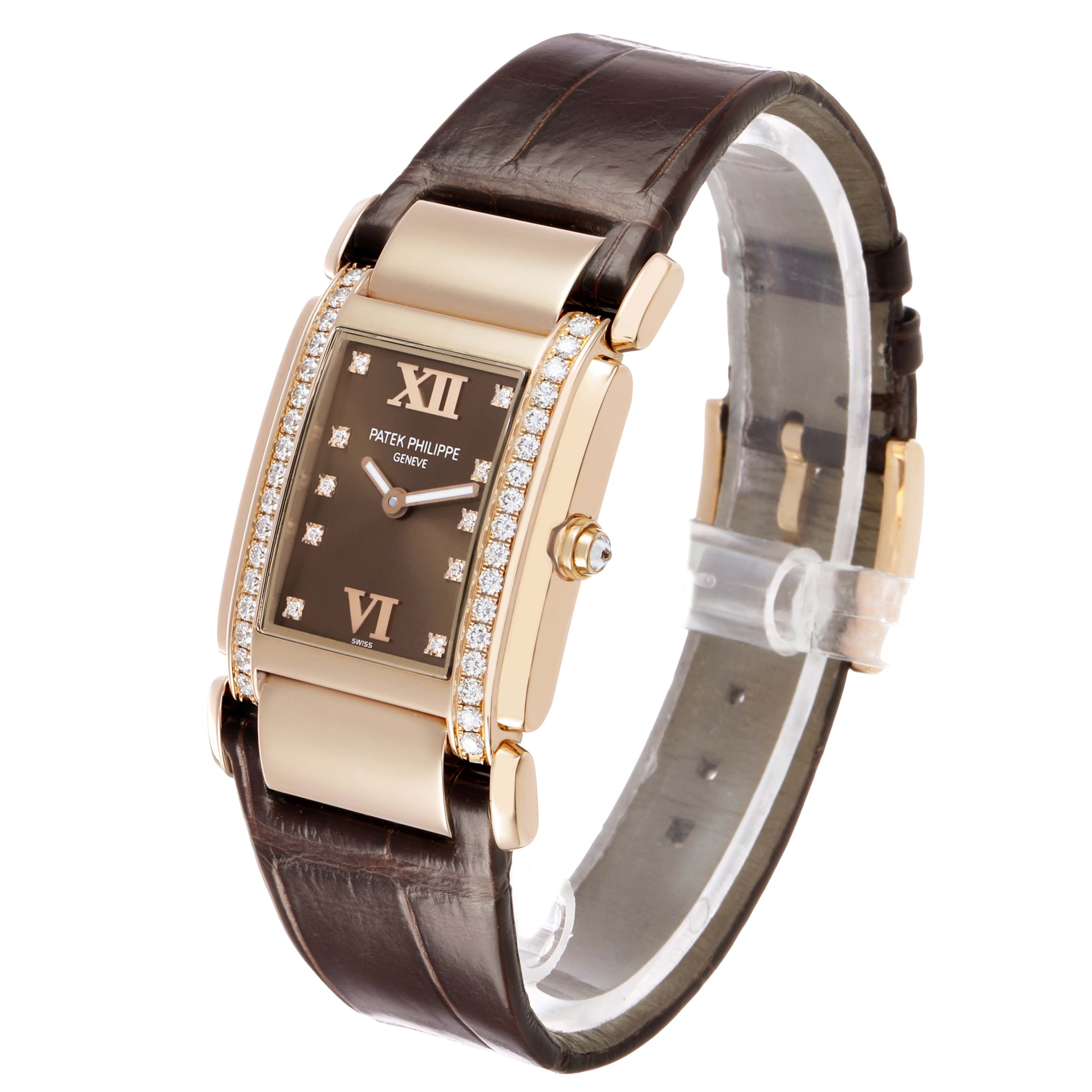 The Patek Philippe Twenty-4 4920R Women's Rose Gold Brown Dial watch is shown at an angled side view, displaying the face, bezel with diamond accents, and leather strap.