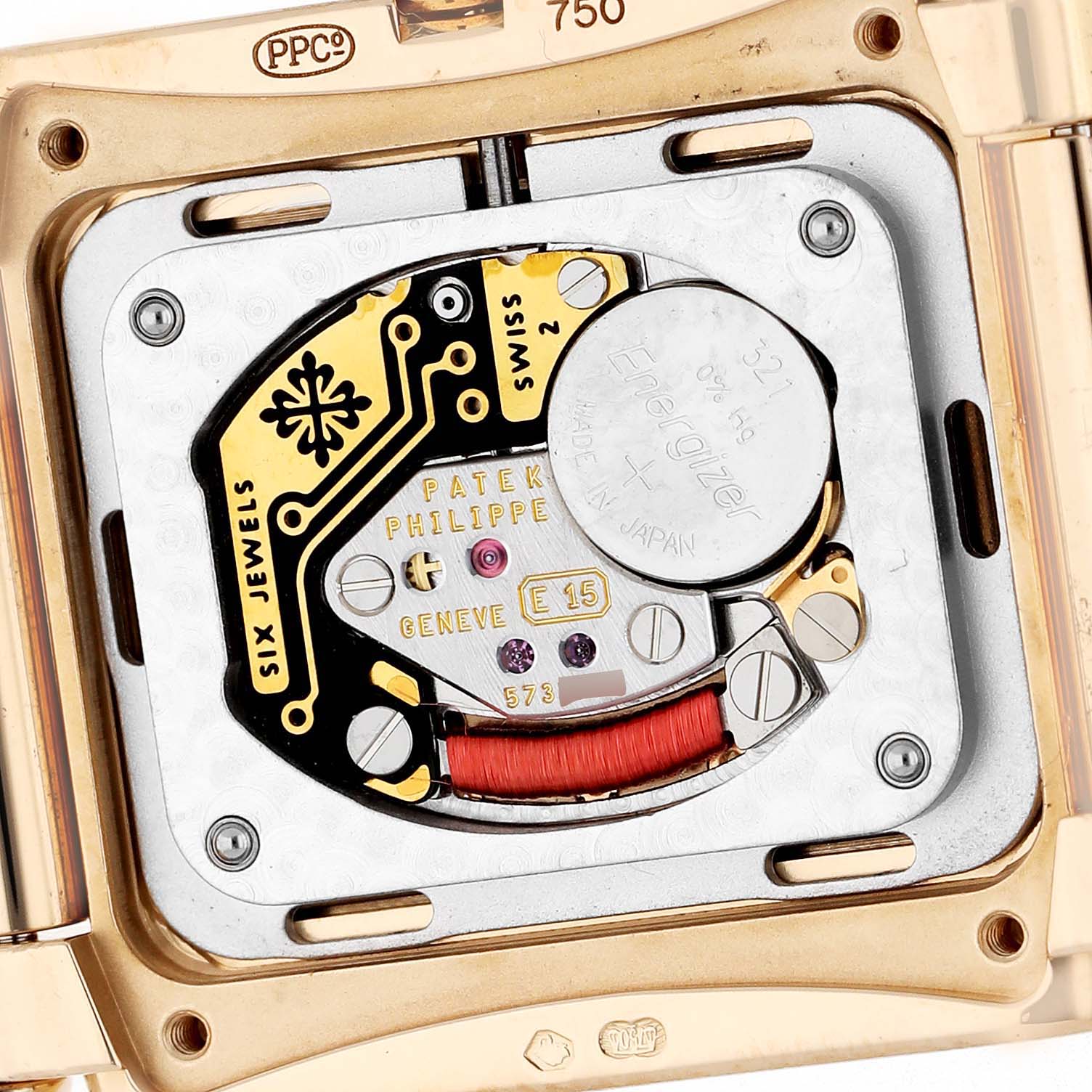 The image shows the back of a Patek Philippe Twenty-4 4920R Women's Rose Gold Brown Dial watch, revealing its movement and internal components.