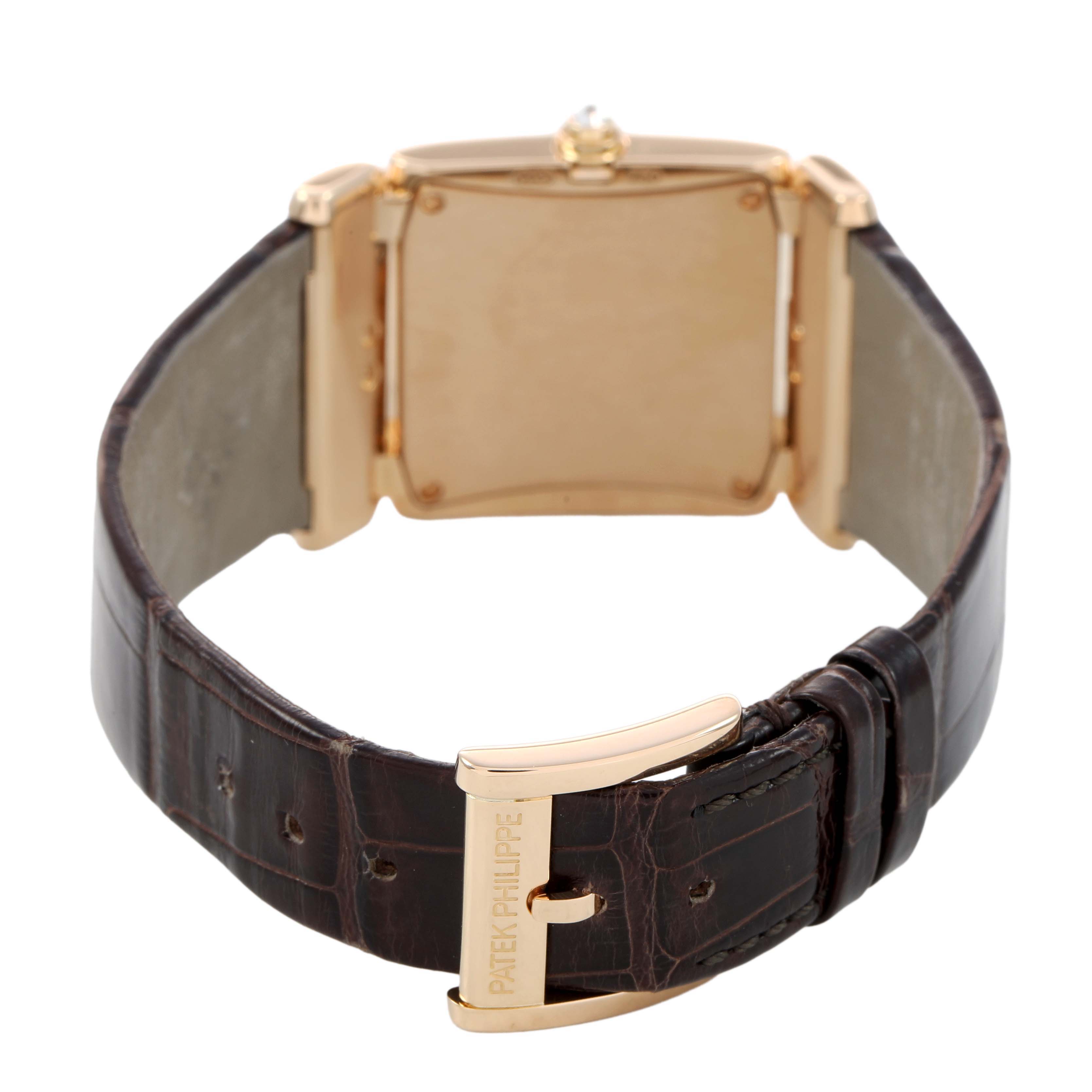 The image shows a rear view of the Patek Philippe Twenty-4 4920R Women's Rose Gold Brown Dial watch, highlighting the case back, clasp, and leather strap.