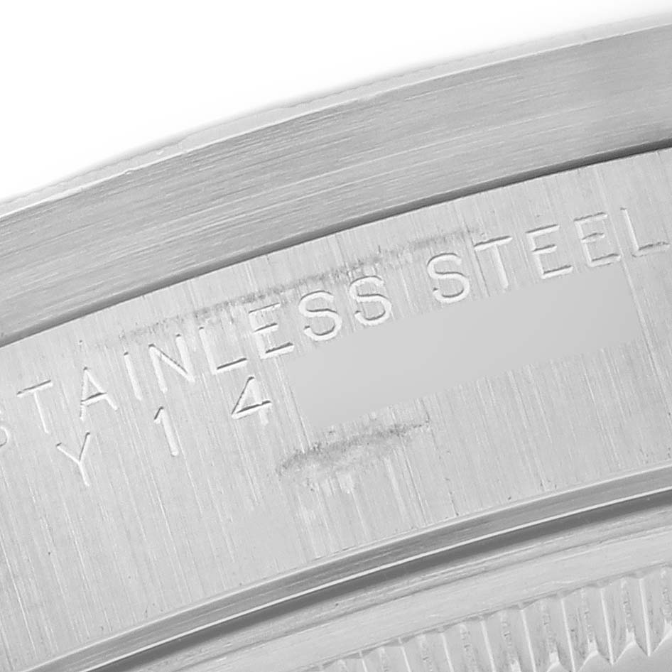 The image shows a close-up view of the case back’s edge of a Rolex Air-King 14010 Men's Stainless Steel Black Dial 14010 Men's Stainless Steel Black Dial watch, highlighting its stainless steel engraving.