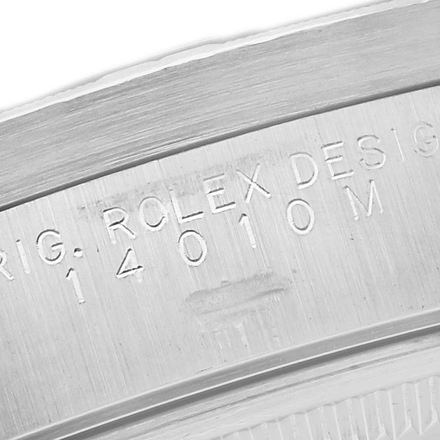 Close-up of the engraved serial number and design number on the case back of a Rolex Air-King 14010 Men's Stainless Steel Black Dial 14010 Men's Stainless Steel Black Dial watch.