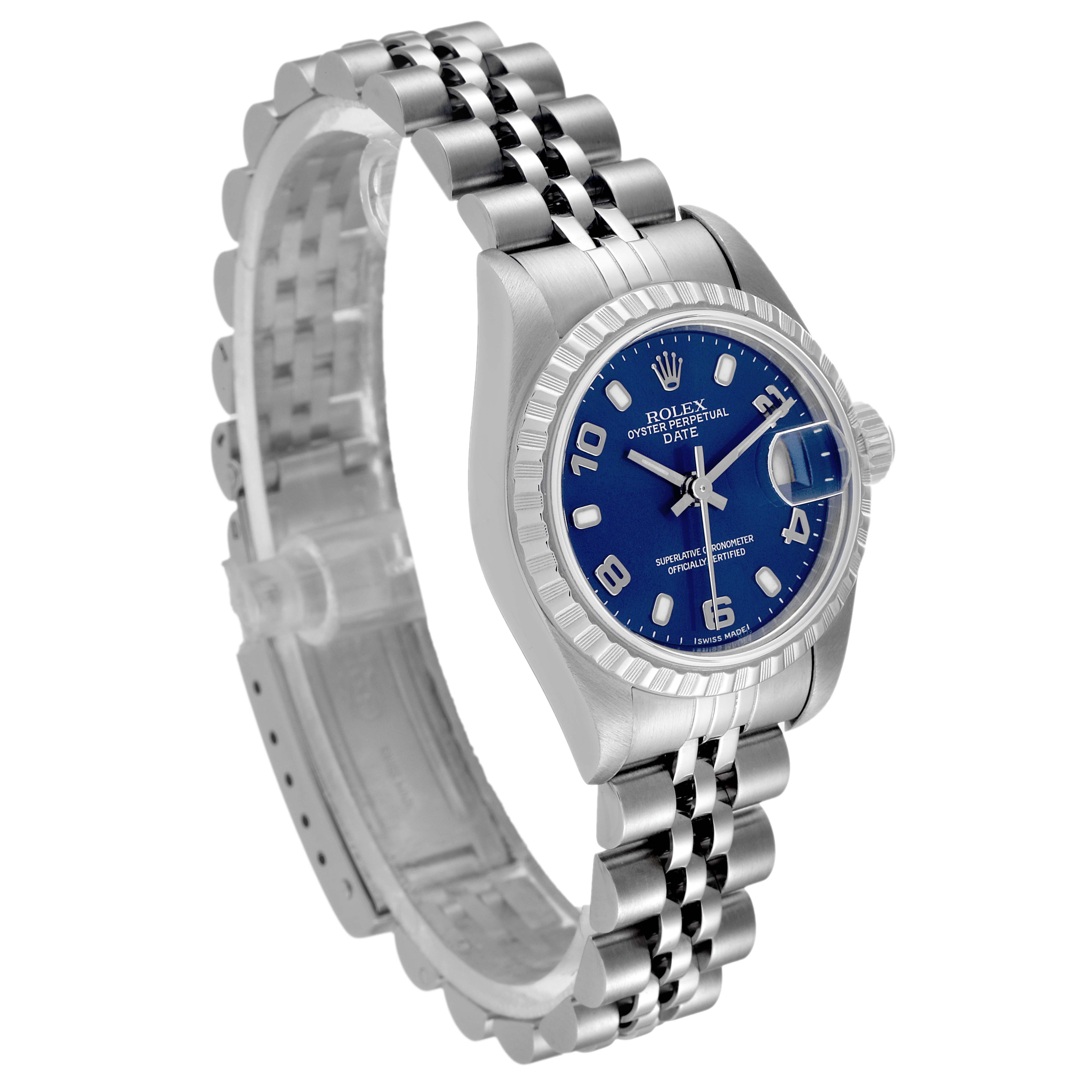 The image shows a Rolex Date 79240 Women's Stainless Steel Blue Dial 79240 Women's Stainless Steel Blue Dial model watch at a tilted angle, highlighting the blue dial, bezel, and Jubilee bracelet.