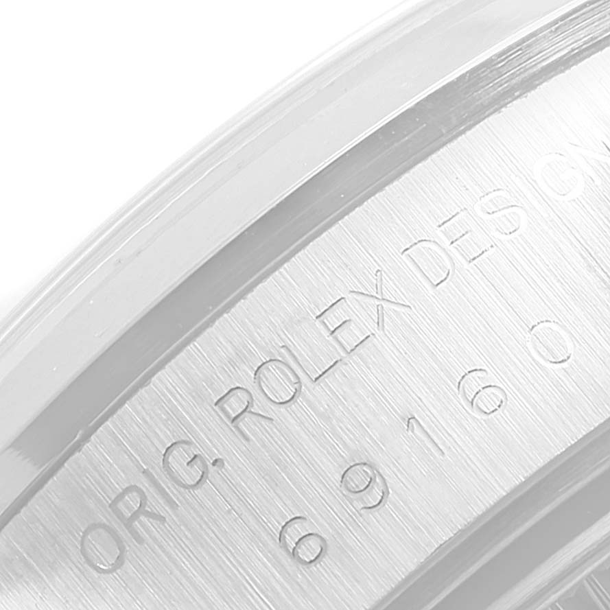 This close-up image shows the side engraving on the bezel of a Rolex Date 69160 Women
s Stainless Steel Silver Dial 69160 Women
s Stainless Steel Silver Dial watch.