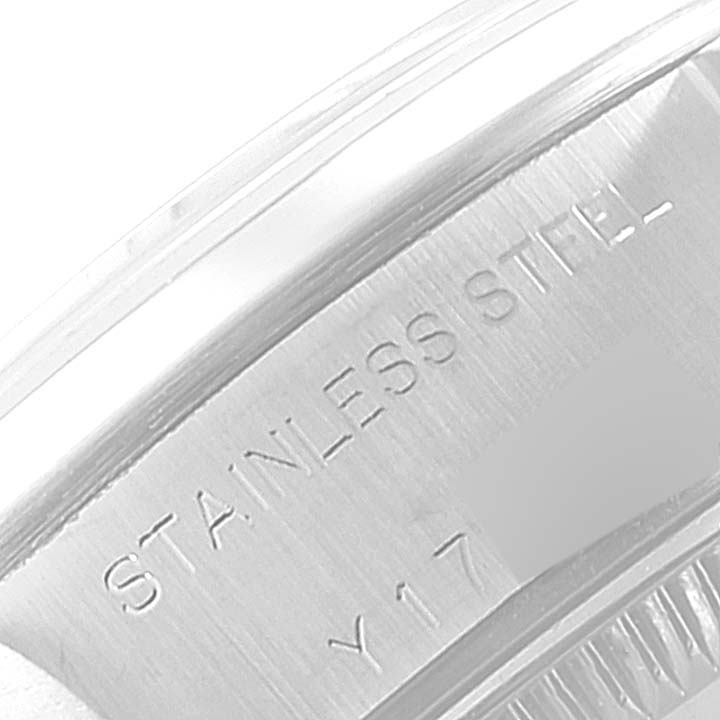 This image shows a close-up of the case back inscription on a Rolex Date 79160 Women's Stainless Steel Silver Dial 79160 Women's Stainless Steel Silver Dial model, highlighting the "Stainless Steel" engraving.