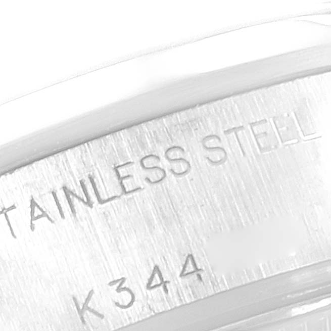 This close-up image shows the stainless steel case back of a Rolex Date 79160 Women's Stainless Steel Silver Dial 79160 Women's Stainless Steel Silver Dial model watch, featuring engraving details.