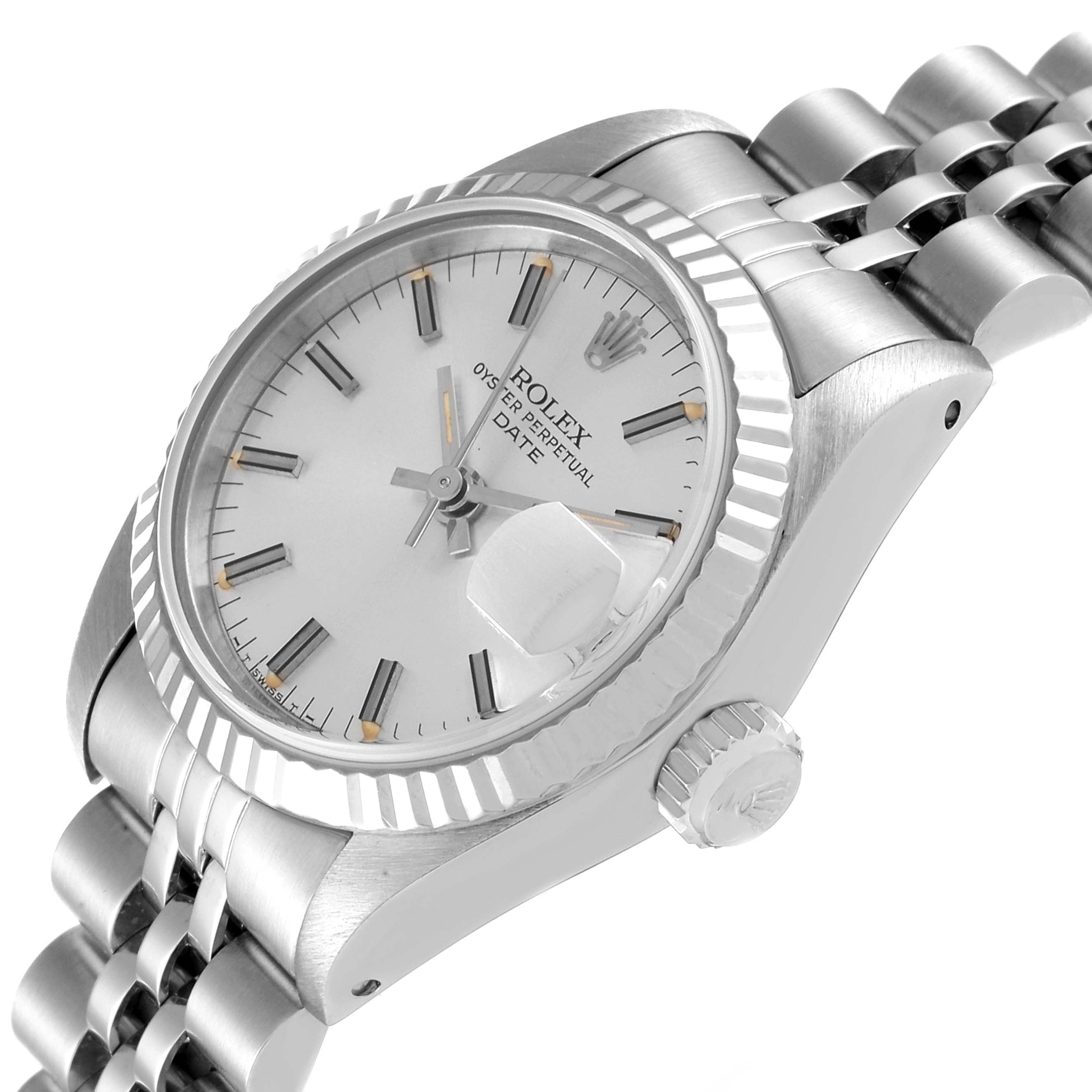 The image shows a side angle of the Rolex Date 69174 Women's Stainless Steel Silver Dial 69174 Women's Stainless Steel Silver Dial model focusing on the dial, fluted bezel, crown, and stainless steel bracelet.