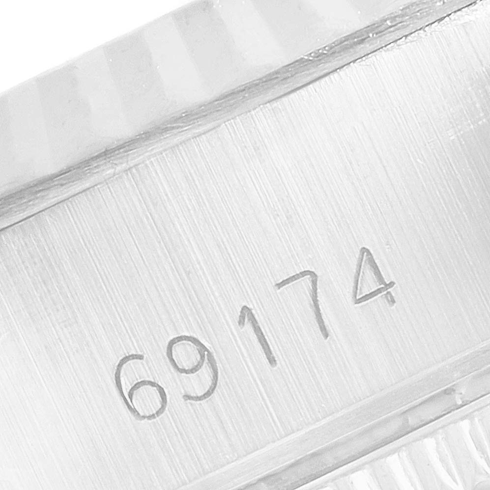 This image shows a close-up view of the serial number engraving on a Rolex Date 69174 Women's Stainless Steel Silver Dial 69174 Women's Stainless Steel Silver Dial model watch. 