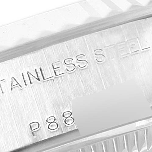 Close-up of the case back engraving for a Rolex Datejust 79174 Women's Stainless Steel Black Dial 79174 Women's Stainless Steel Black Dial model, showing "STAINLESS STEEL" and a partial serial number.