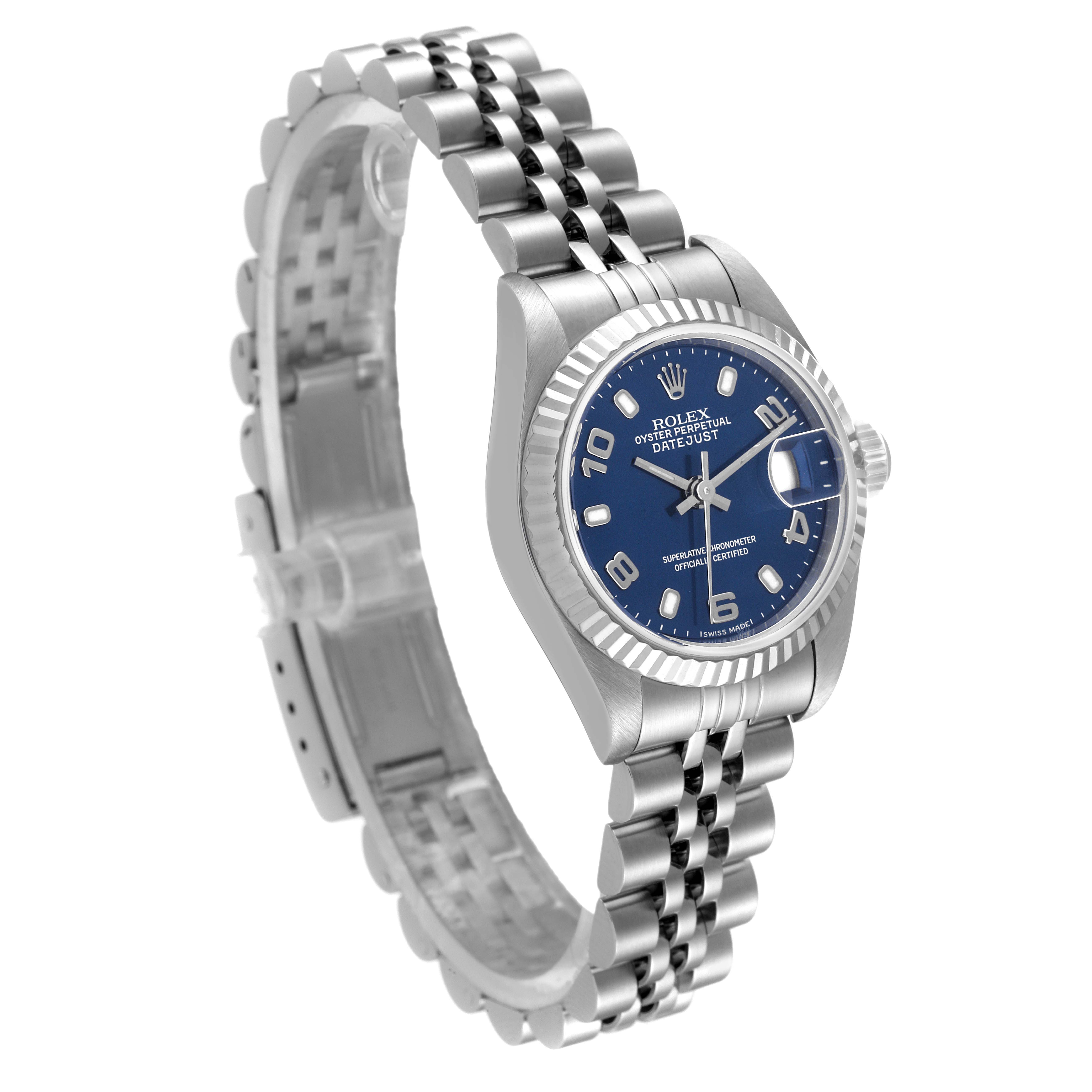 The image shows a front angle of a Rolex Datejust 79174 Women
s Stainless Steel Blue Dial 79174 Women
s Stainless Steel Blue Dial watch, highlighting the blue dial, fluted bezel, and Jubilee bracelet.