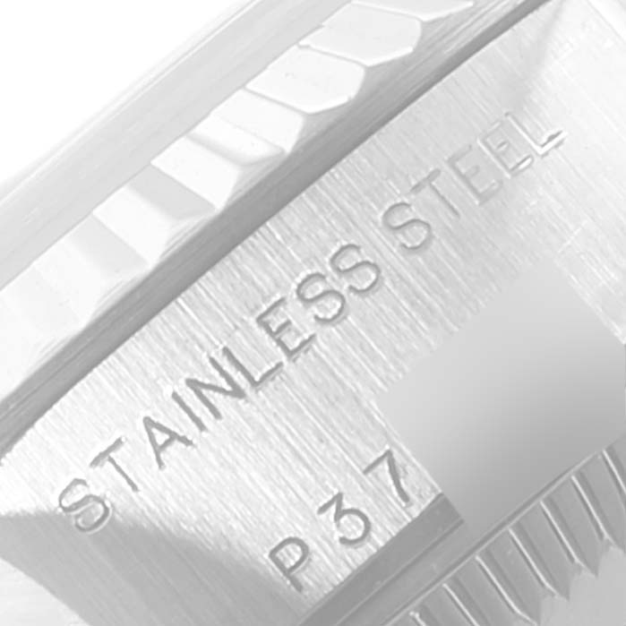 The image shows a close-up of the stainless steel case and fluted bezel of a Rolex Datejust 79174 Women
s Stainless Steel Blue Dial 79174 Women
s Stainless Steel Blue Dial watch.