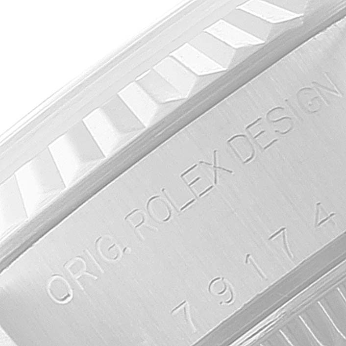 This image shows a close-up of the engraved text on the case side of a Rolex Datejust 79174 Women
s Stainless Steel Blue Dial 79174 Women
s Stainless Steel Blue Dial watch.