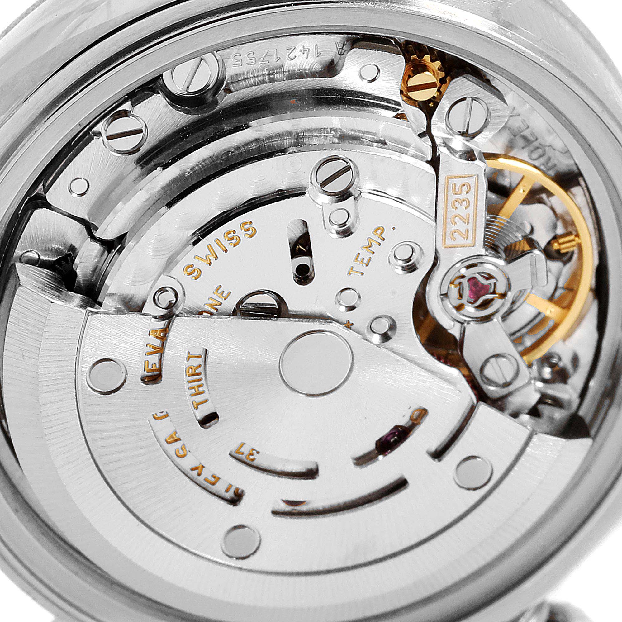 This image shows a close-up view of the movement mechanism inside a Rolex Datejust 79174 Women
s Stainless Steel Pink Dial 79174 Women
s Stainless Steel Pink Dial watch.