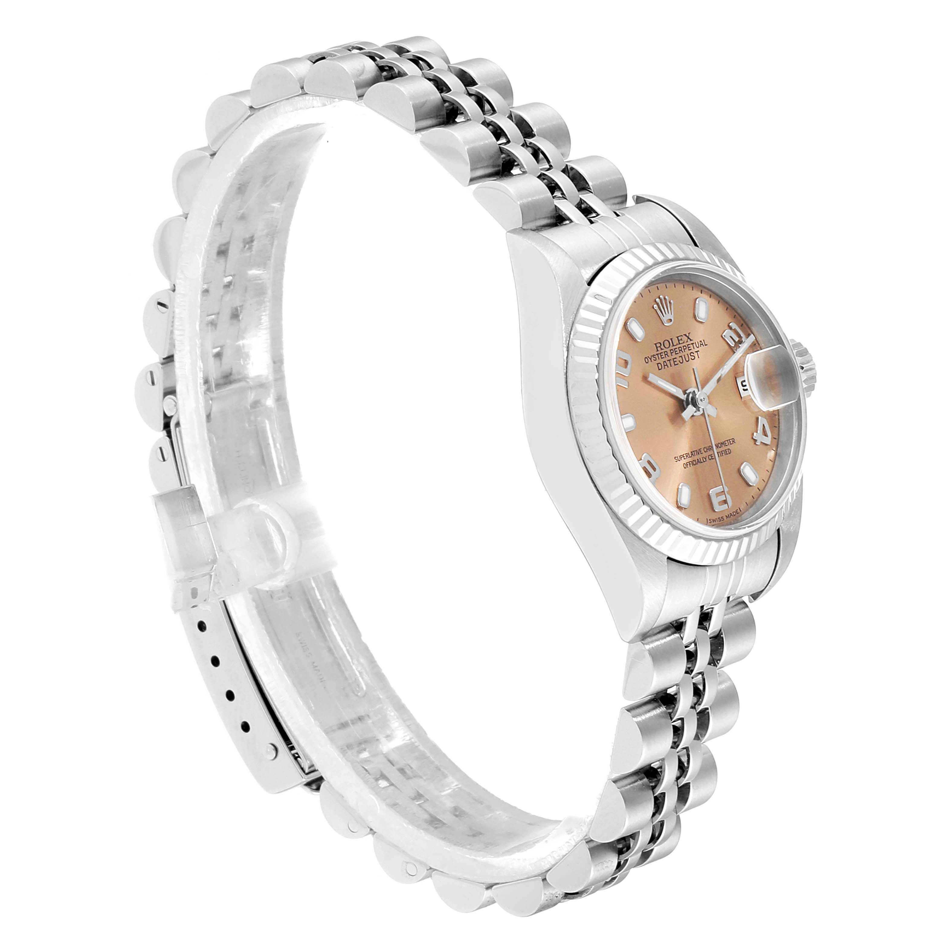 The image shows a side angle view of a Rolex Datejust 79174 Women
s Stainless Steel Pink Dial 79174 Women
s Stainless Steel Pink Dial watch, highlighting its bracelet, bezel, and face.