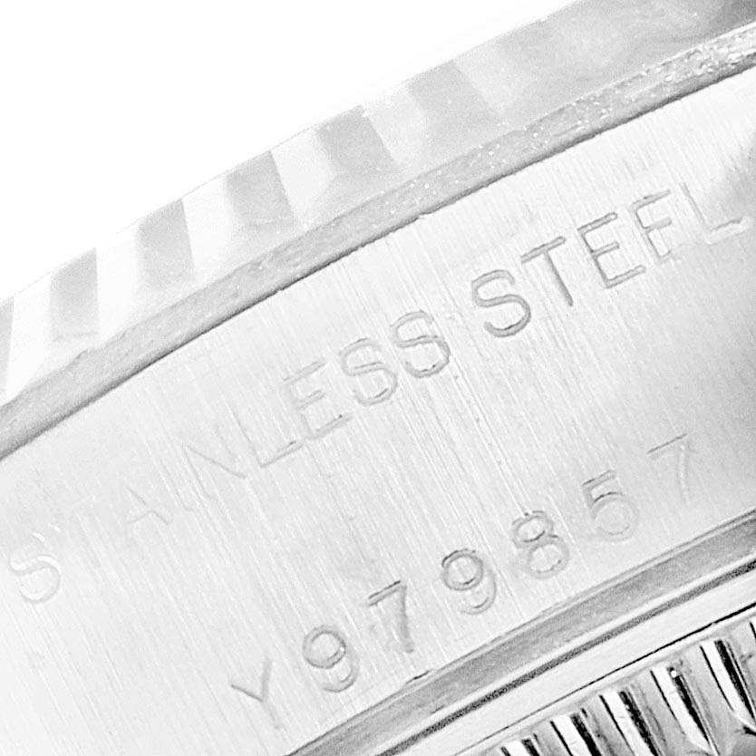 This close-up image shows the engraving on the case edge of a Rolex Datejust 79174 Women
s Stainless Steel Pink Dial 79174 Women
s Stainless Steel Pink Dial watch.