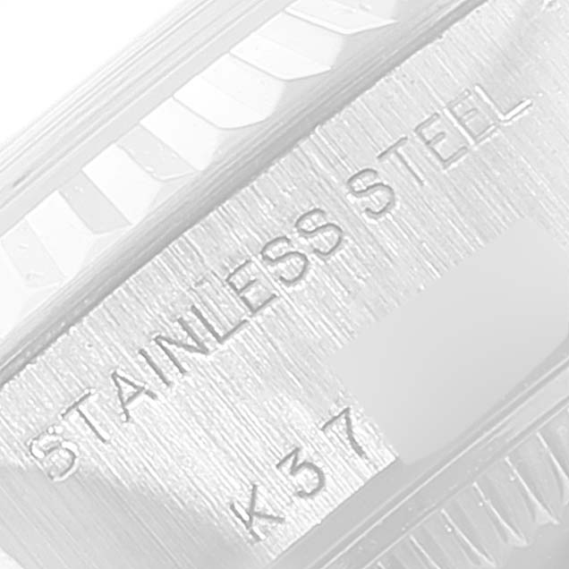 The image shows a close-up of the stainless steel part of the Rolex Datejust 79174 Women
s Stainless Steel Silver Dial 79174 Women
s Stainless Steel Silver Dial watch with the engraving visible.