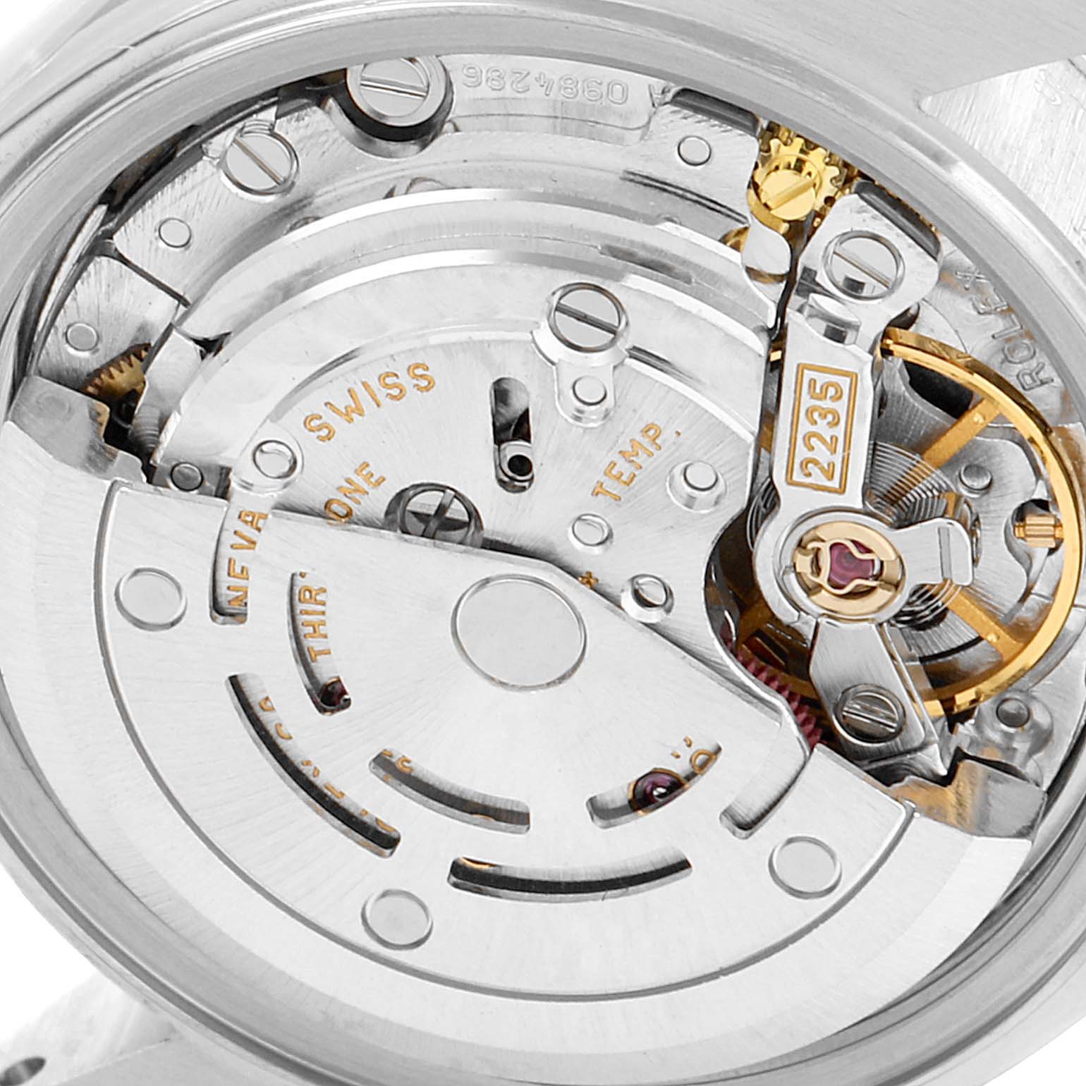 The image shows a close-up view of the Rolex Datejust 79174 Women
s Stainless Steel Silver Dial 79174 Women
s Stainless Steel Silver Dial watch
s movement mechanism with the rotor and balance wheel visible.