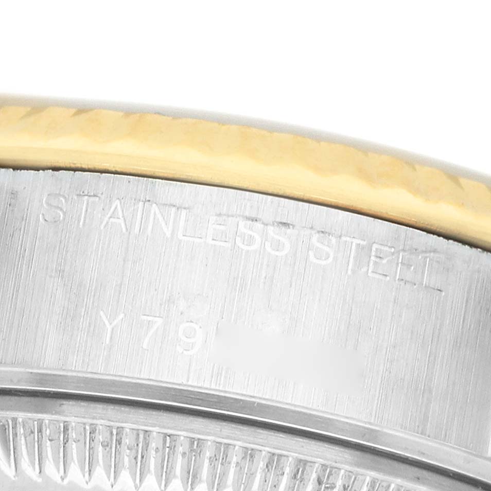 The image shows a close-up of the side of a Rolex Datejust 79173 Women's Steel and Gold (two tone) Champagne Dial watch, highlighting the stainless steel case and part of the bezel.