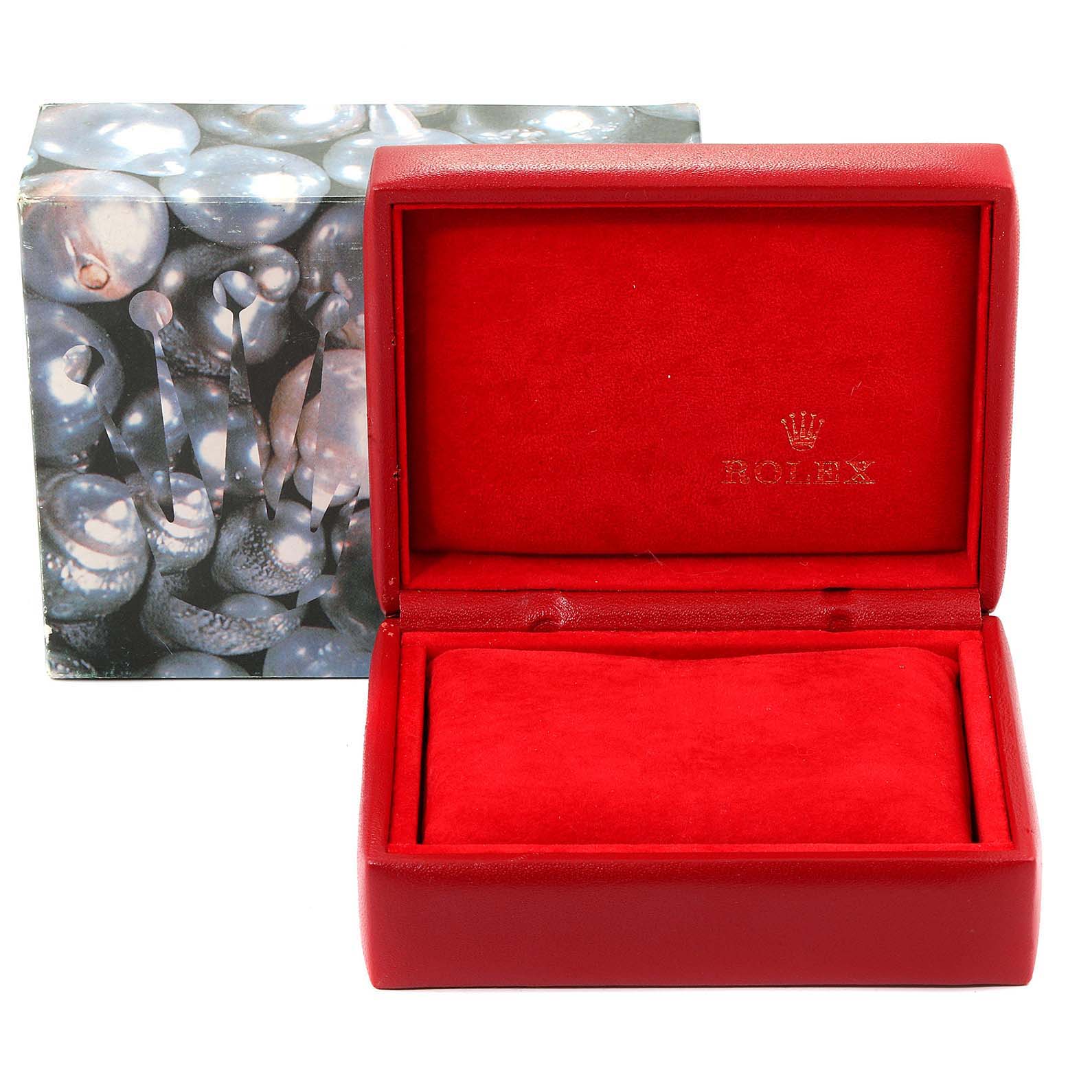 This image shows a red Rolex Datejust 69173 Women
s Steel and Gold (two tone) Champagne Dial 69173 Women
s Steel and Gold (two tone) Champagne Dial watch box, open with the velvet interior and pillow, displaying the Rolex logo.