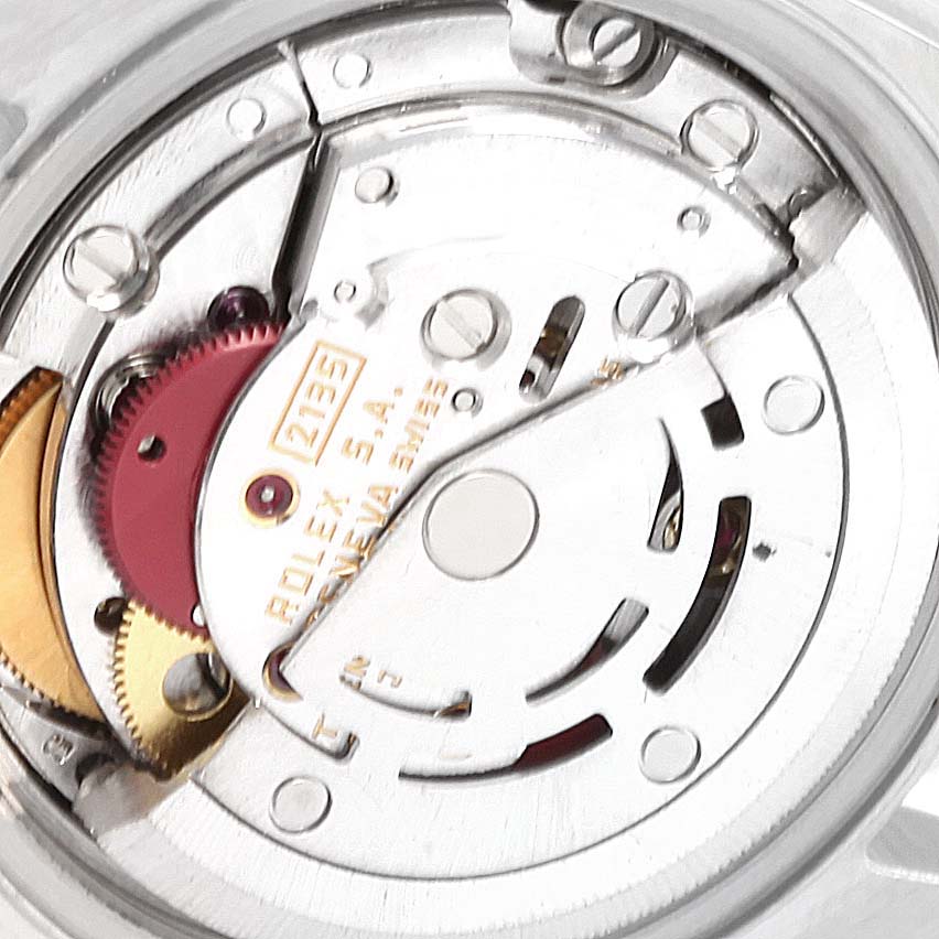 This image shows a close-up view of the movement mechanism of a Rolex Datejust 69173 Women's Steel and Gold (two tone) Red Dial 69173 Women's Steel and Gold (two tone) Red Dial watch.