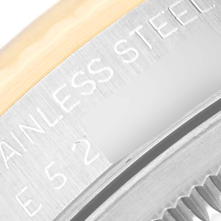 This image shows a magnified view of the back casing of a Rolex Datejust 16233 Men's Steel and Gold (two tone) Black Dial 16233 Men's Steel and Gold (two tone) Black Dial watch, highlighting the "Stainless Steel" engraving.