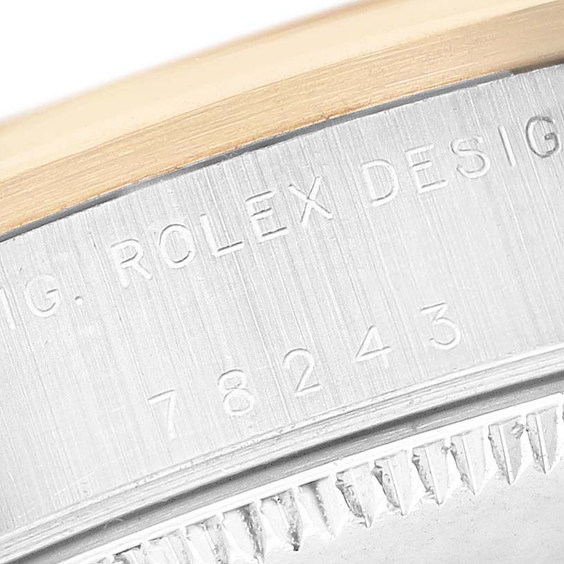 The image shows the side view of a Rolex Mid-Size 78243 Women's Steel and Gold (two tone) White Dial watch case with model number engraving.