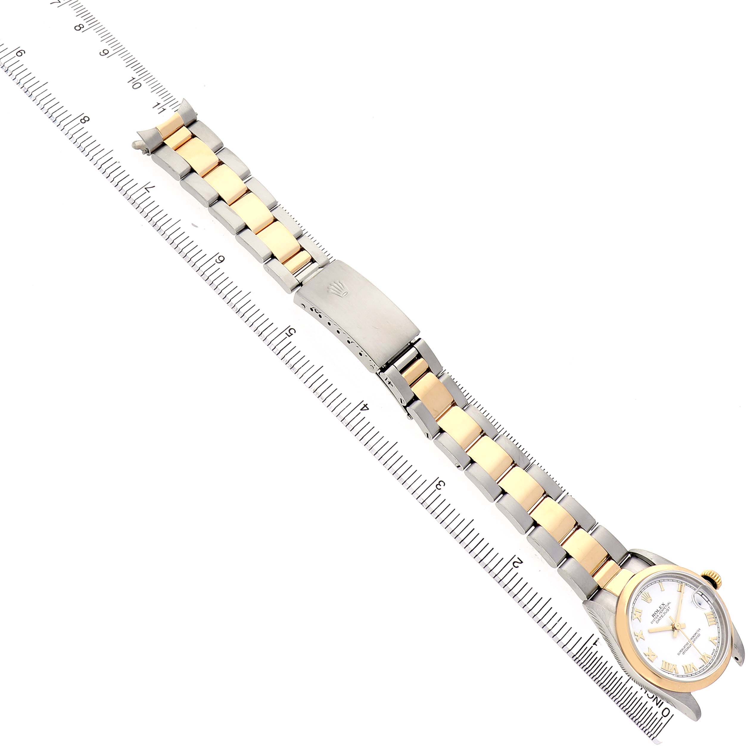 The Rolex Mid-Size 78243 Women's Steel and Gold (two tone) White Dial watch is shown from a top-down view, highlighting its bracelet, clasp, and face.