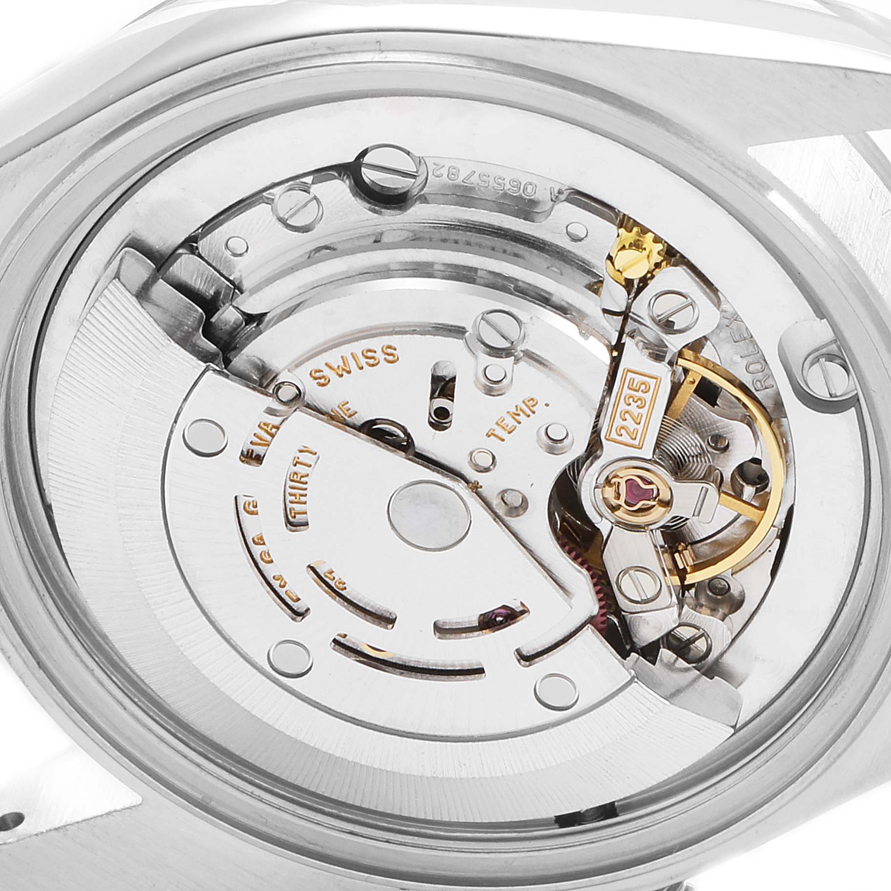 This image shows the internal mechanism and movement of a Mid-Size Rolex watch viewed from the back.