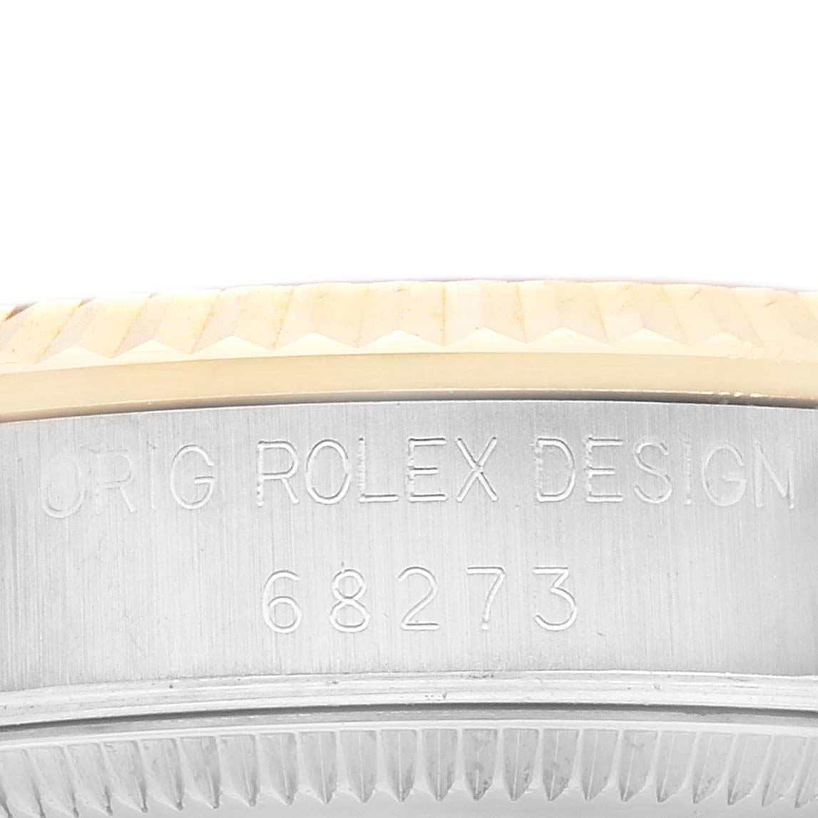 This image shows a close-up of the model number on the case edge of a Mid-Size Rolex watch, model number 68273.