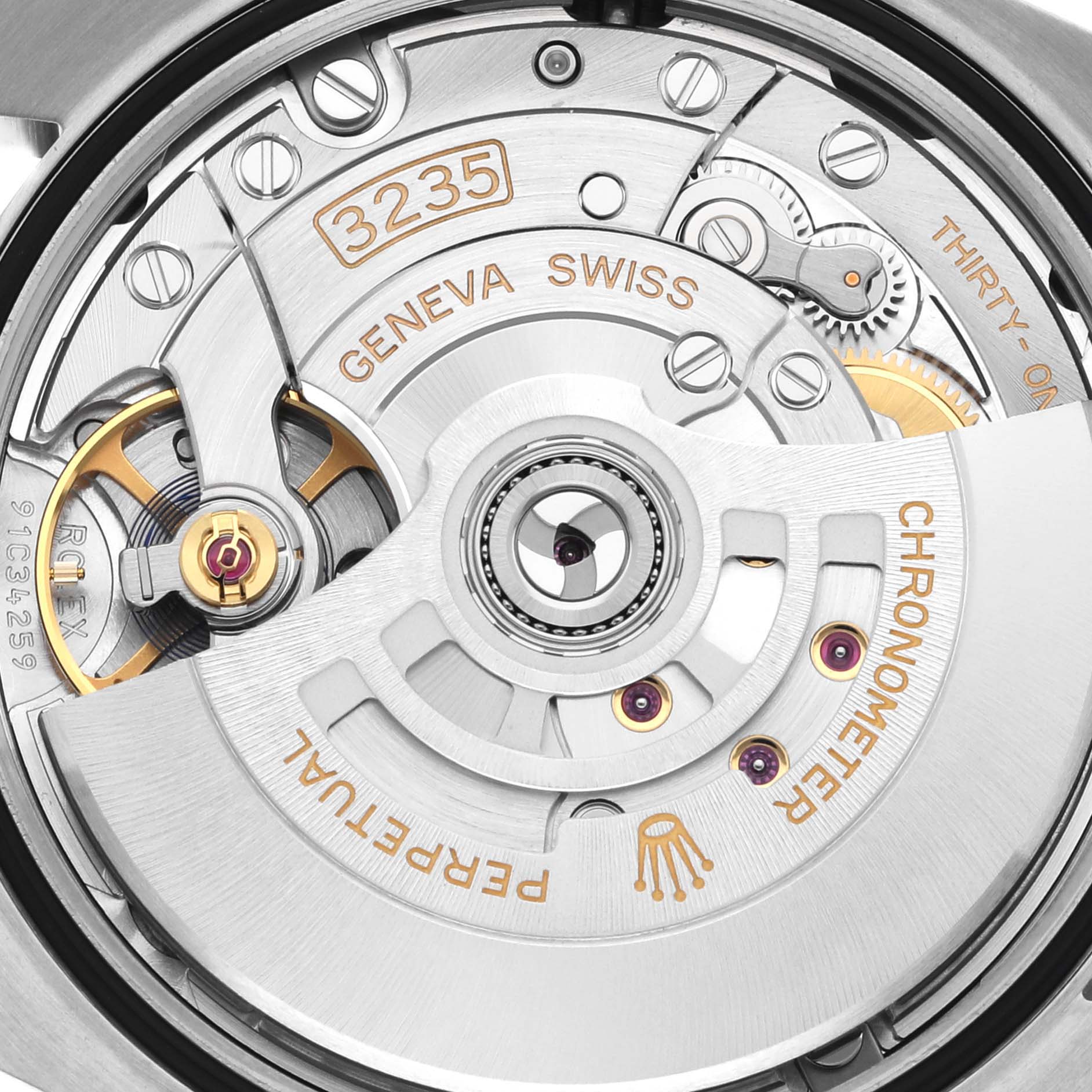 This image shows a close-up view of the movement mechanism of a Rolex Datejust 126200 Men's Stainless Steel Green Dial 126200 Men's Stainless Steel Green Dial watch, model 3235, including the rotor and gears.