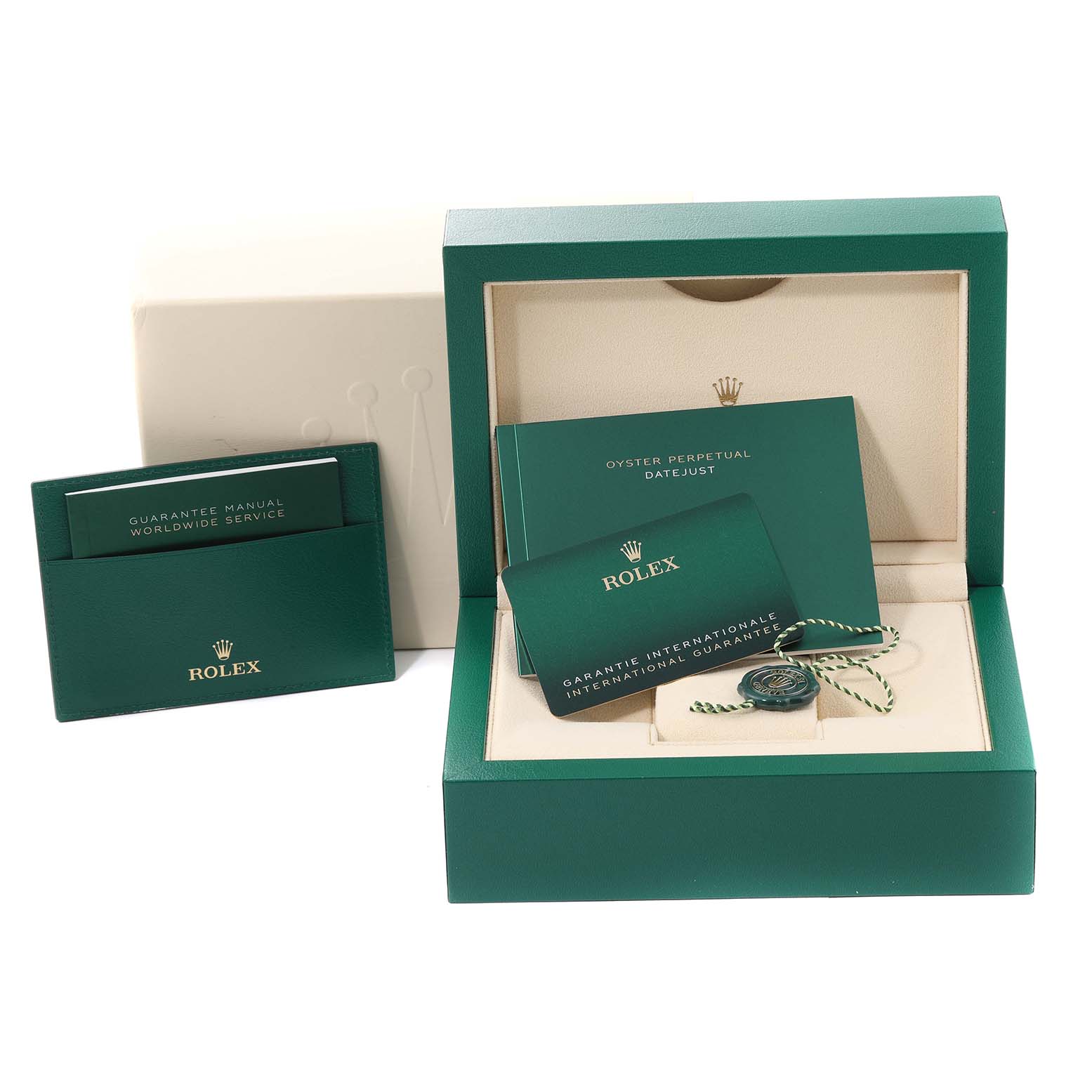 The image shows Rolex Datejust 126200 Men's Stainless Steel Green Dial 126200 Men's Stainless Steel Green Dial watch accessories, including manuals, guarantee cards, a box, and a tag, from a top angle.