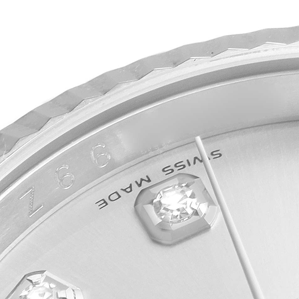 This close-up angle of the Rolex Datejust 116234 Men's Stainless Steel Silver Dial 116234 Men's Stainless Steel Silver Dial watch shows part of the bezel, dial, and a diamond marker.