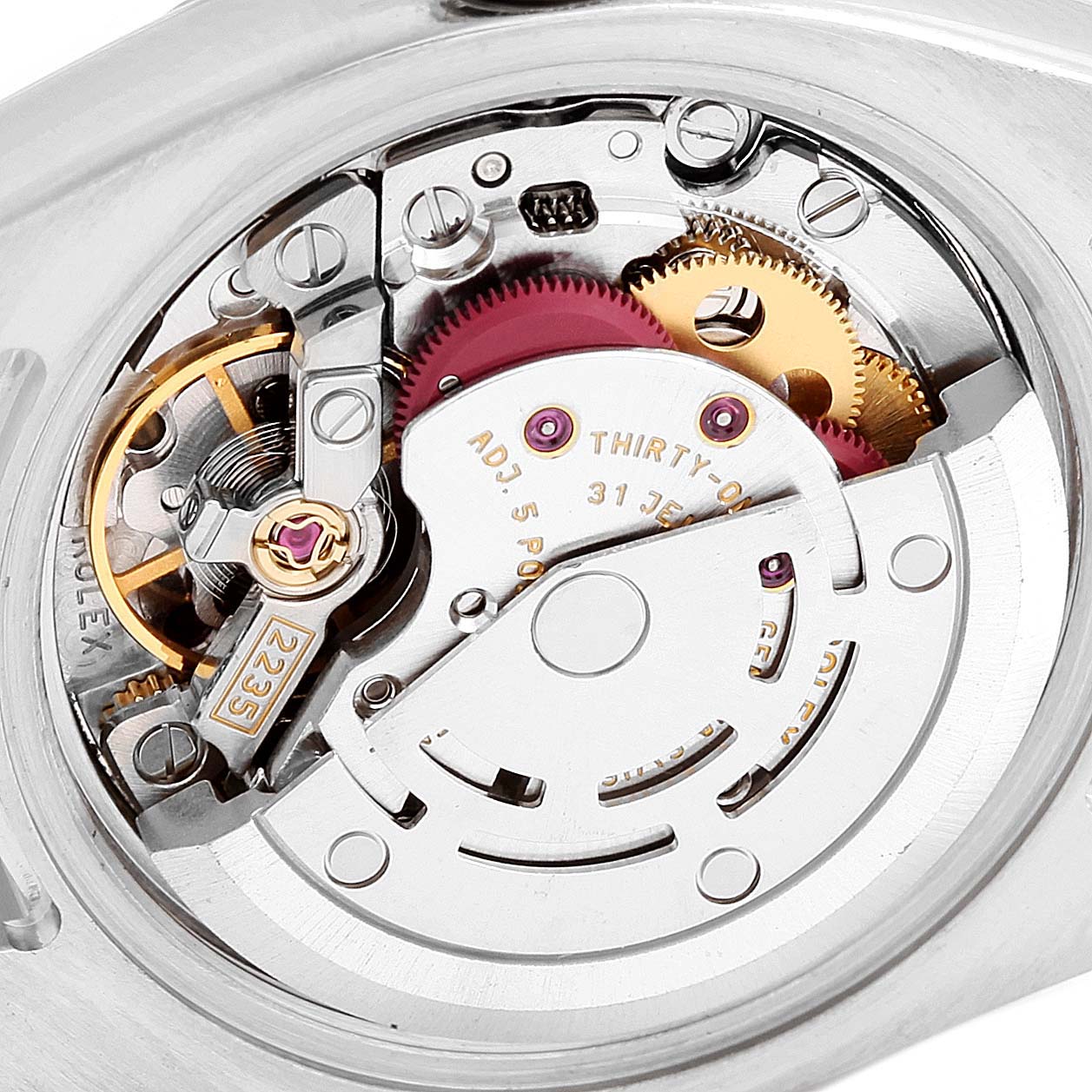 This close-up image shows the intricate internal mechanism of a Rolex Datejust 179174 Women
s Stainless Steel Silver Dial 179174 Women
s Stainless Steel Silver Dial watch from an angle that highlights its movement components.