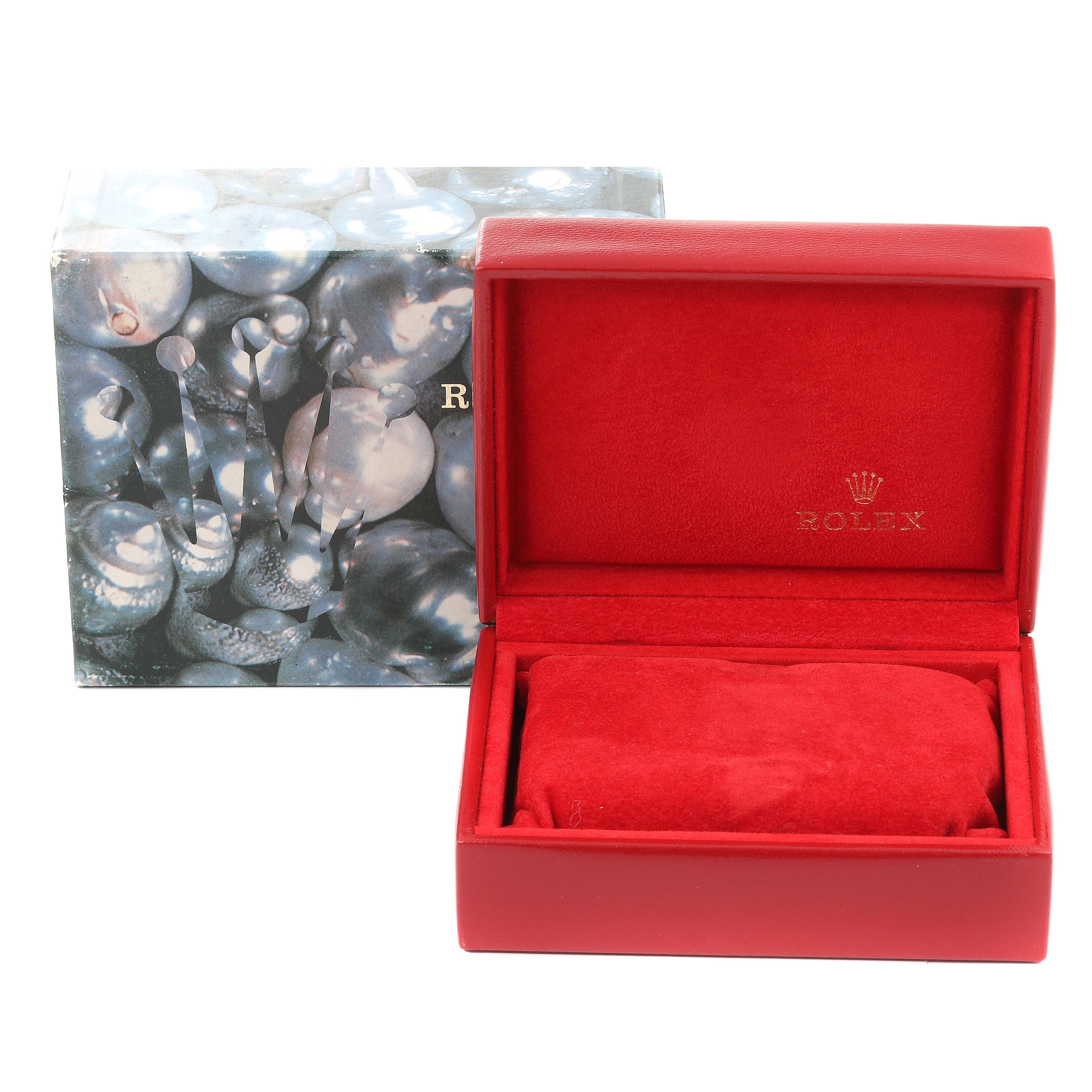 The image shows a red Rolex Datejust 69174 Women
s Stainless Steel Silver Dial 69174 Women
s Stainless Steel Silver Dial watch box with the accompanying outer box in the background.