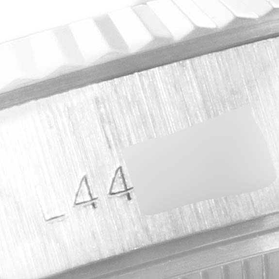 This image shows a close-up of the brushed metal case side and fluted bezel of a Rolex Datejust 69174 Women
s Stainless Steel Silver Dial 69174 Women
s Stainless Steel Silver Dial watch.