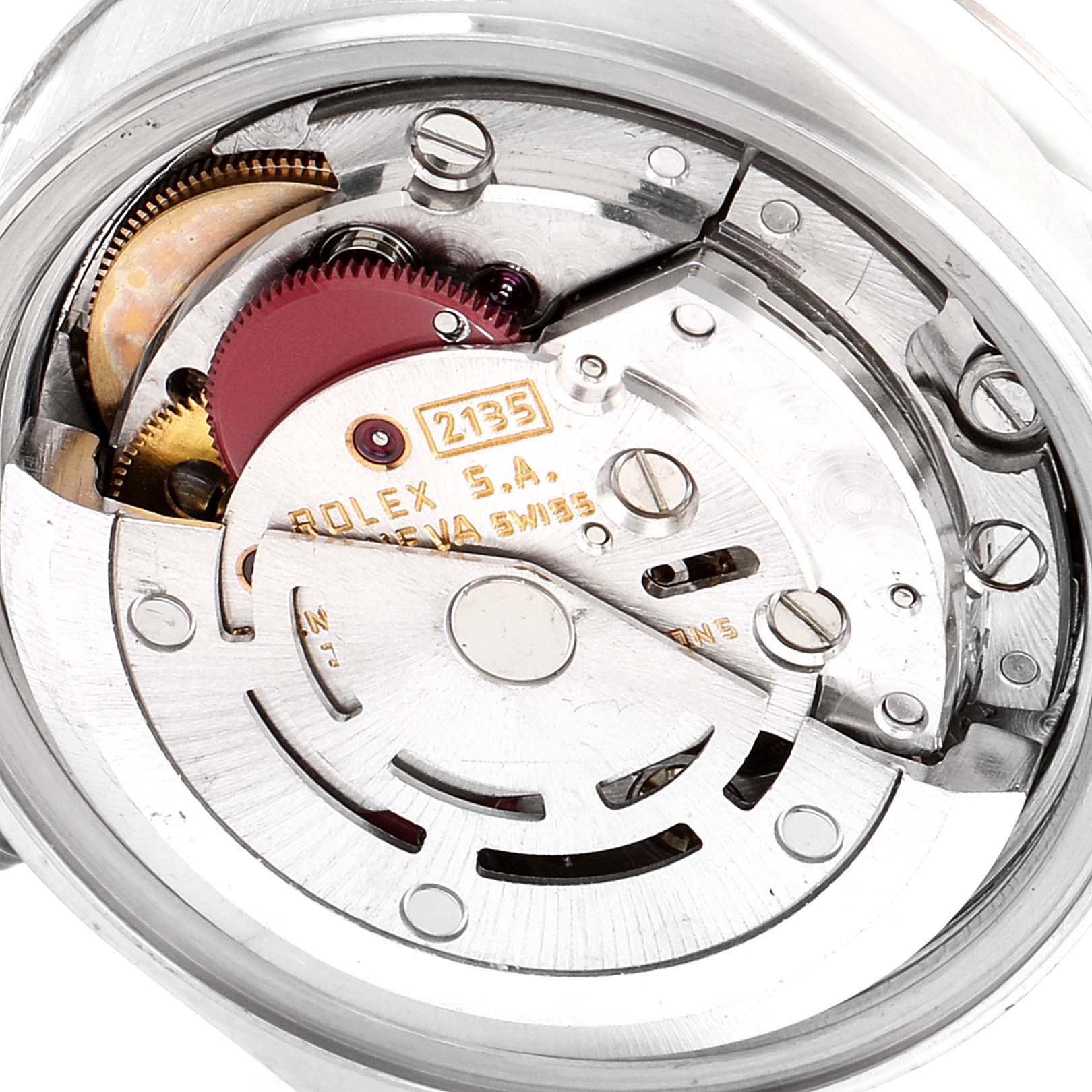 This is a close-up view of the internal movement mechanisms of a Rolex Datejust 69174 Women
s Stainless Steel Silver Dial 69174 Women
s Stainless Steel Silver Dial watch, showcasing gears and the rotor.