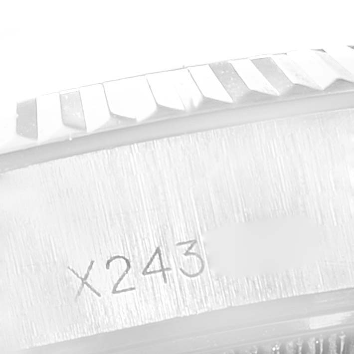 This image shows a close-up angle of the bezel and serial number area of a Rolex Datejust 69174 Women
s Stainless Steel Silver Dial 69174 Women
s Stainless Steel Silver Dial watch.
