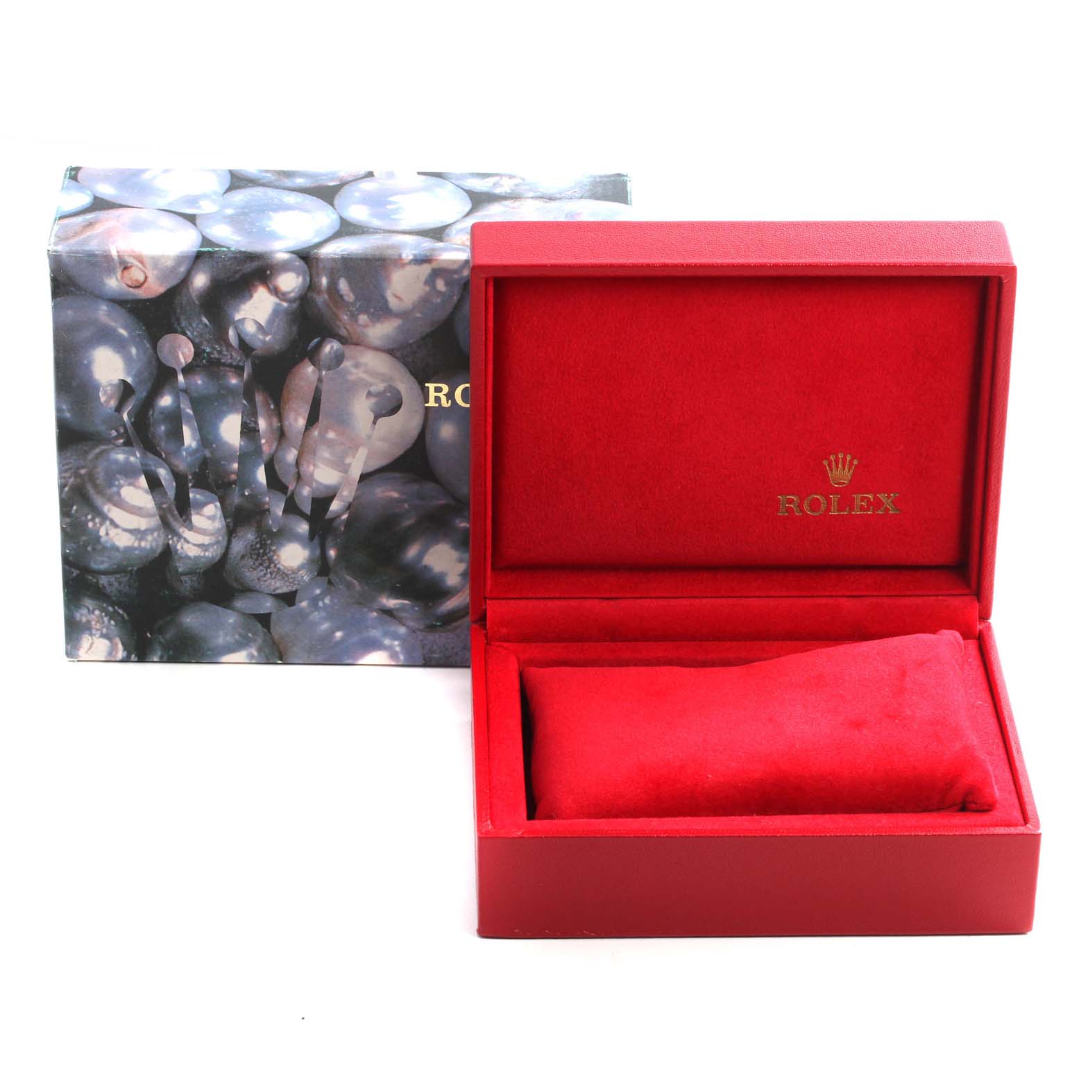The image shows an opened red Rolex watch box and its lid, with the outer packaging box placed behind it.