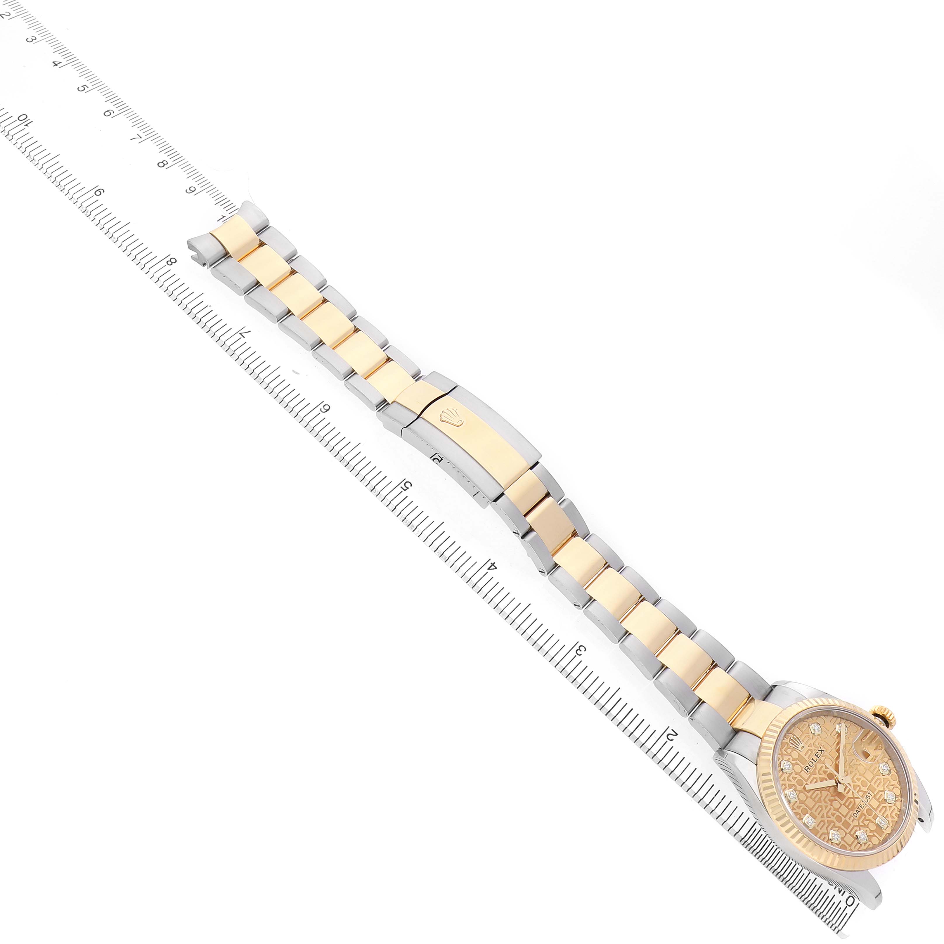 The image shows a side view of a Rolex Datejust 126233 Men's Steel and Gold (two tone) Champagne Dial watch, displaying its two-tone bracelet and face alongside a ruler.