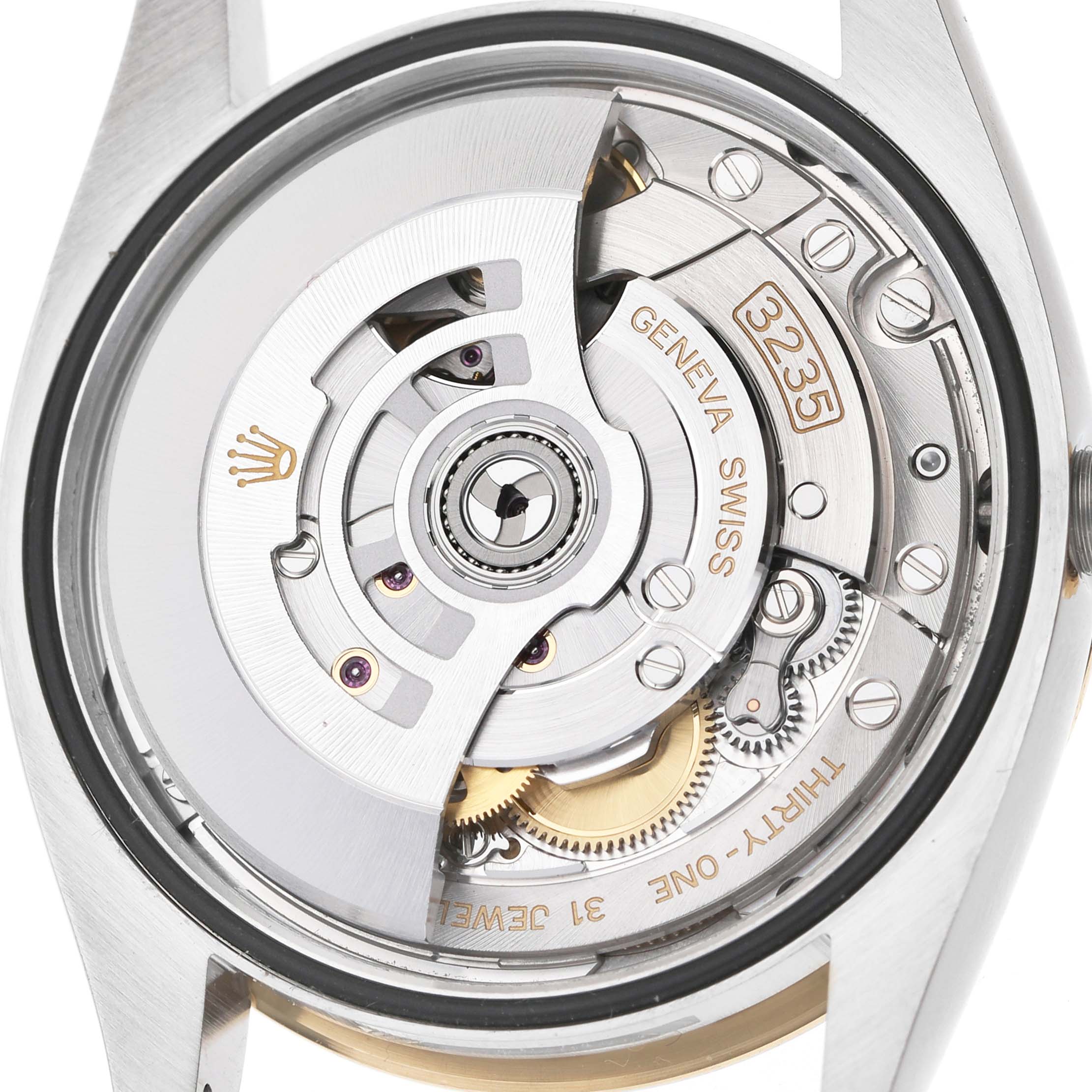 This image shows the open case back of a Rolex Datejust 126233 Men's Steel and Gold (two tone) Champagne Dial, highlighting the movement and rotor mechanism.