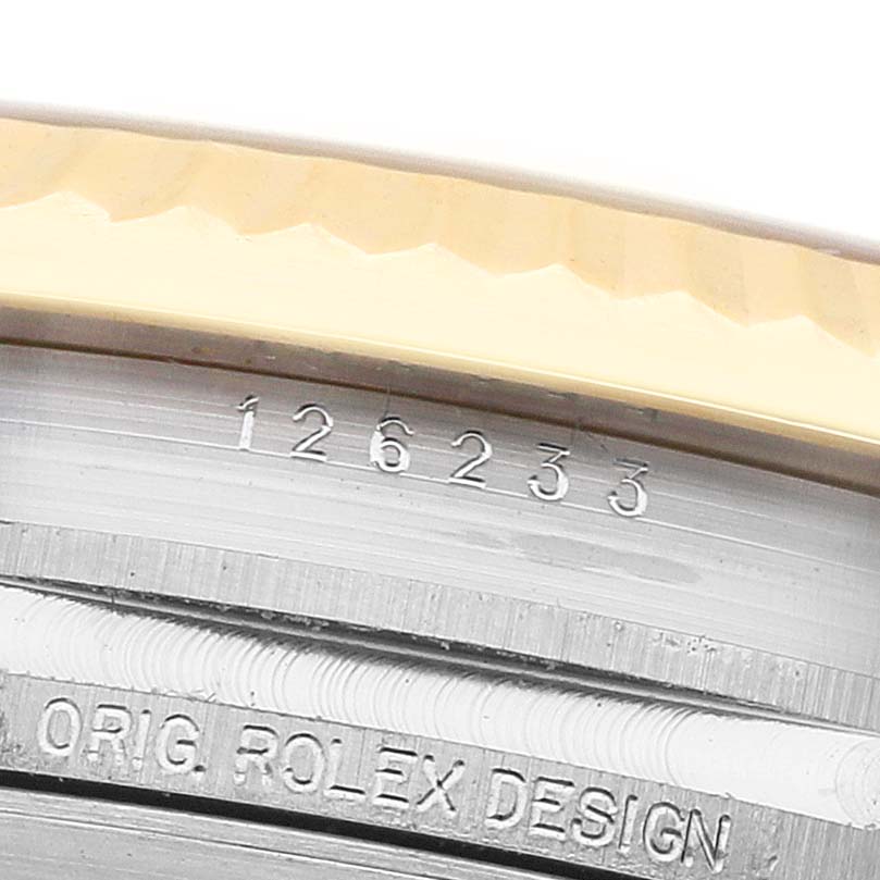 The image shows a close-up of the side of a Rolex Datejust 126233 Men's Steel and Gold (two tone) Champagne Dial, focusing on the model number and "ORIG. ROLEX DESIGN" engraving.