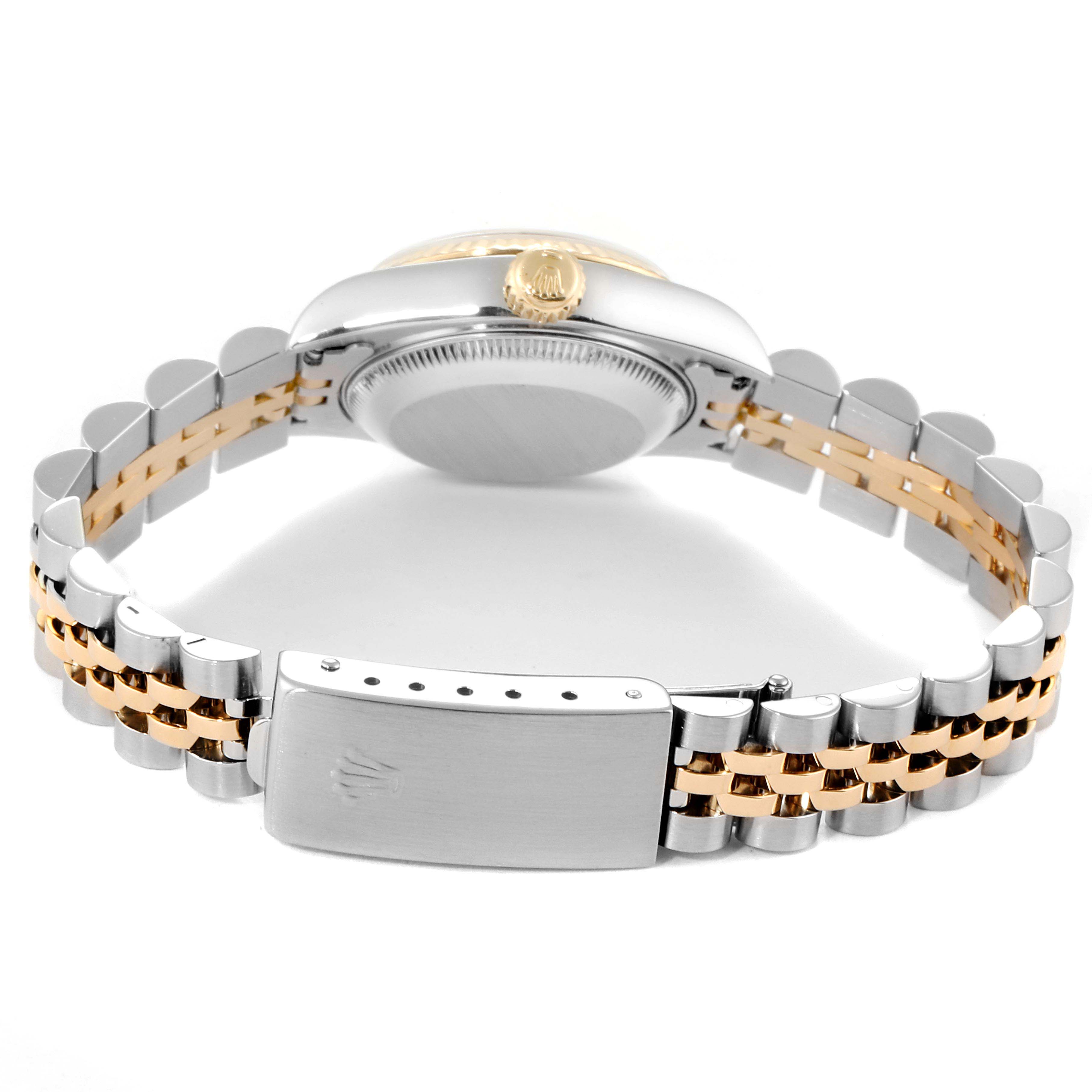 The image shows the Rolex Datejust 69173 Women
s Steel and Gold (two tone) Champagne Dial 69173 Women
s Steel and Gold (two tone) Champagne Dial watch from a rear angle, highlighting the clasp, bracelet, and case back.