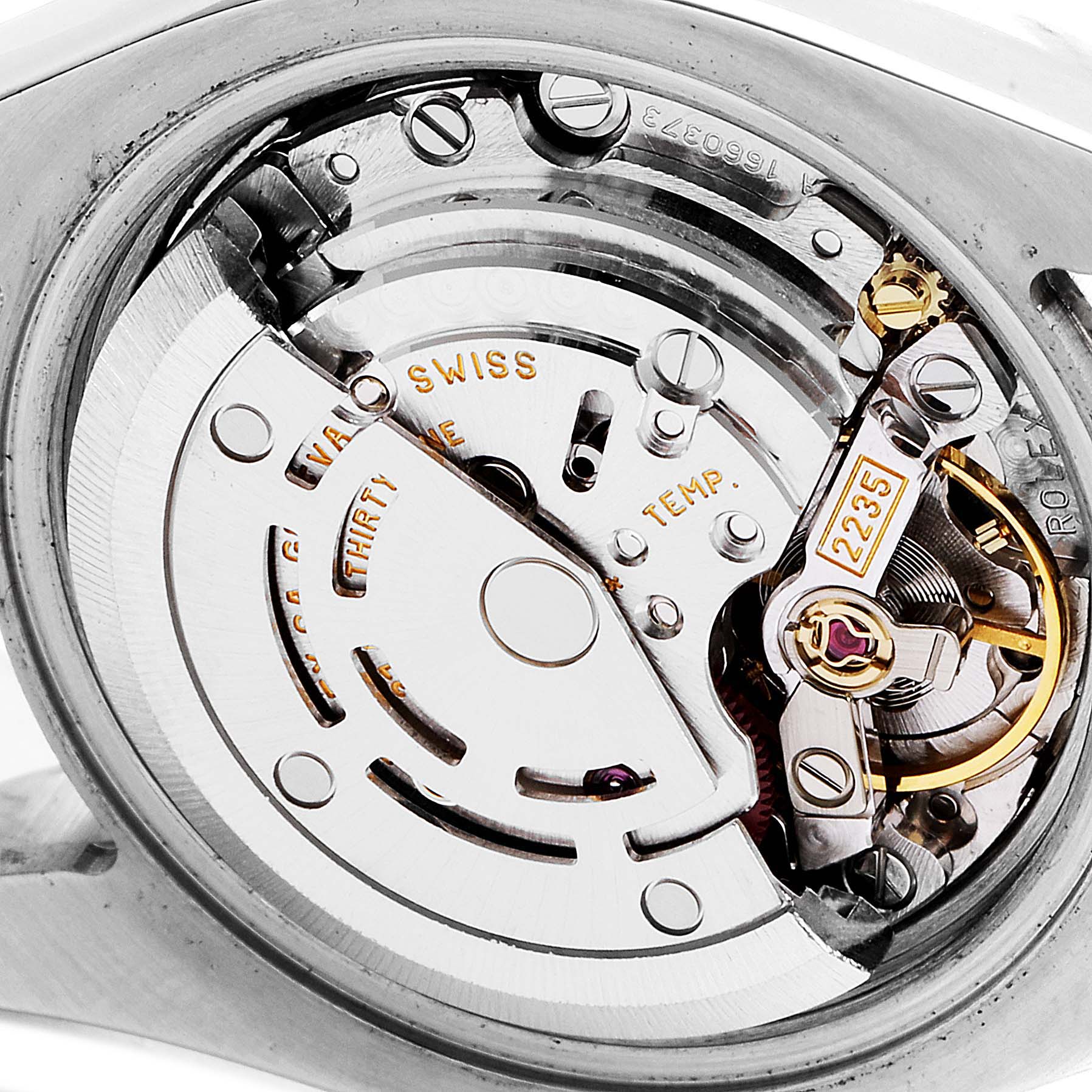 The image shows an intricate close-up of the movement mechanism of a Rolex Datejust 179173 Women's Steel and Gold (two tone) Mother of Pearl Dial 179173 Women's Steel and Gold (two tone) Mother of Pearl Dial watch.