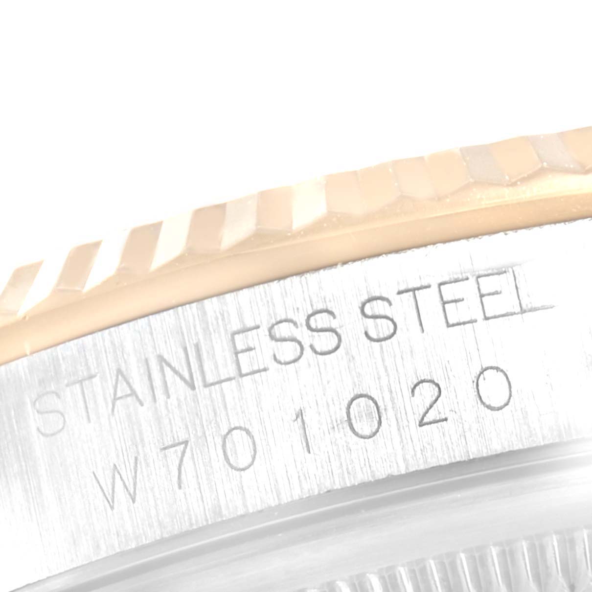 This close-up image shows the side of the bezel and engraved text on the case of a Rolex Datejust 16233 Men
s Steel and Gold (two tone) Silver Dial 16233 Men
s Steel and Gold (two tone) Silver Dial watch.