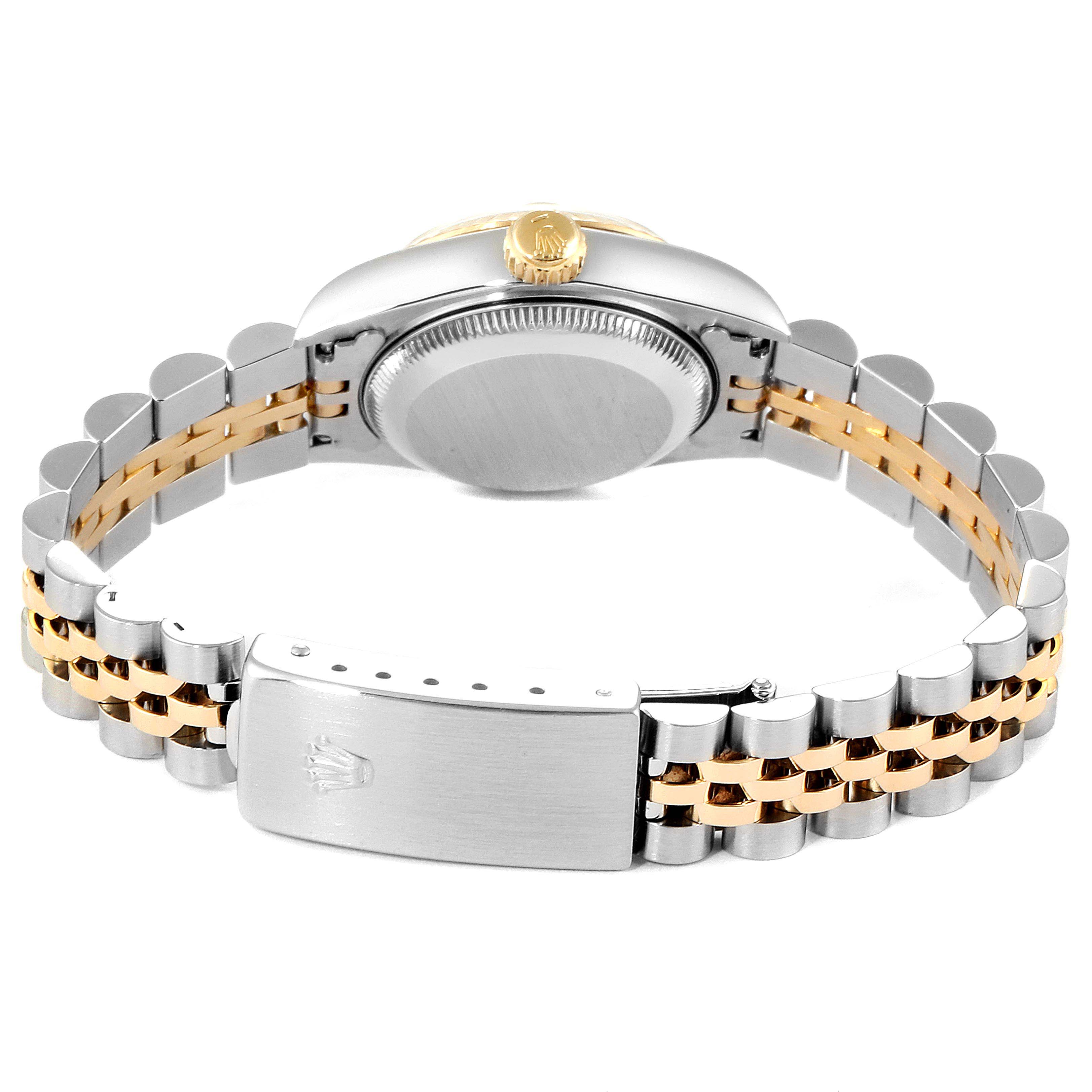 This image shows the back of the Rolex Datejust 69173 Women
s Steel and Gold (two tone) White Dial 69173 Women
s Steel and Gold (two tone) White Dial watch, highlighting the clasp, case back, and bi-metal bracelet.