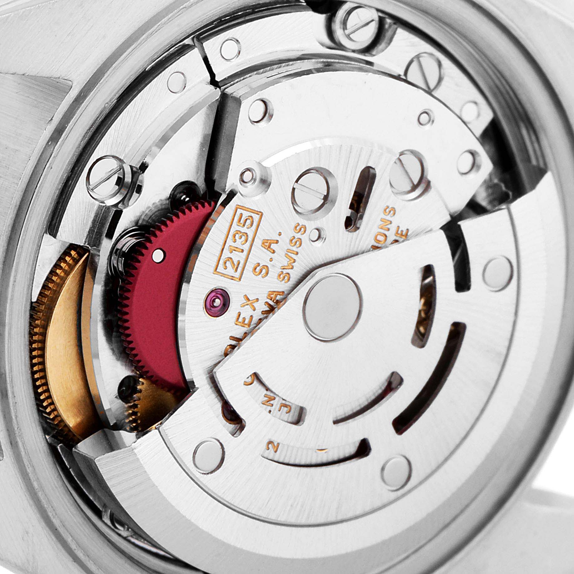 This close-up image shows the intricate mechanics of the Rolex Datejust 69173 Women
s Steel and Gold (two tone) White Dial 69173 Women
s Steel and Gold (two tone) White Dial watch movement and parts.