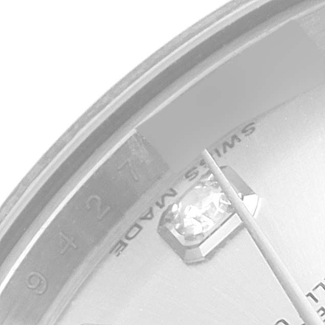 This close-up image of a Rolex Datejust 179174 Women's Stainless Steel Silver Dial 179174 Women's Stainless Steel Silver Dial watch shows part of the dial, a diamond hour marker, and the "Swiss Made" text.