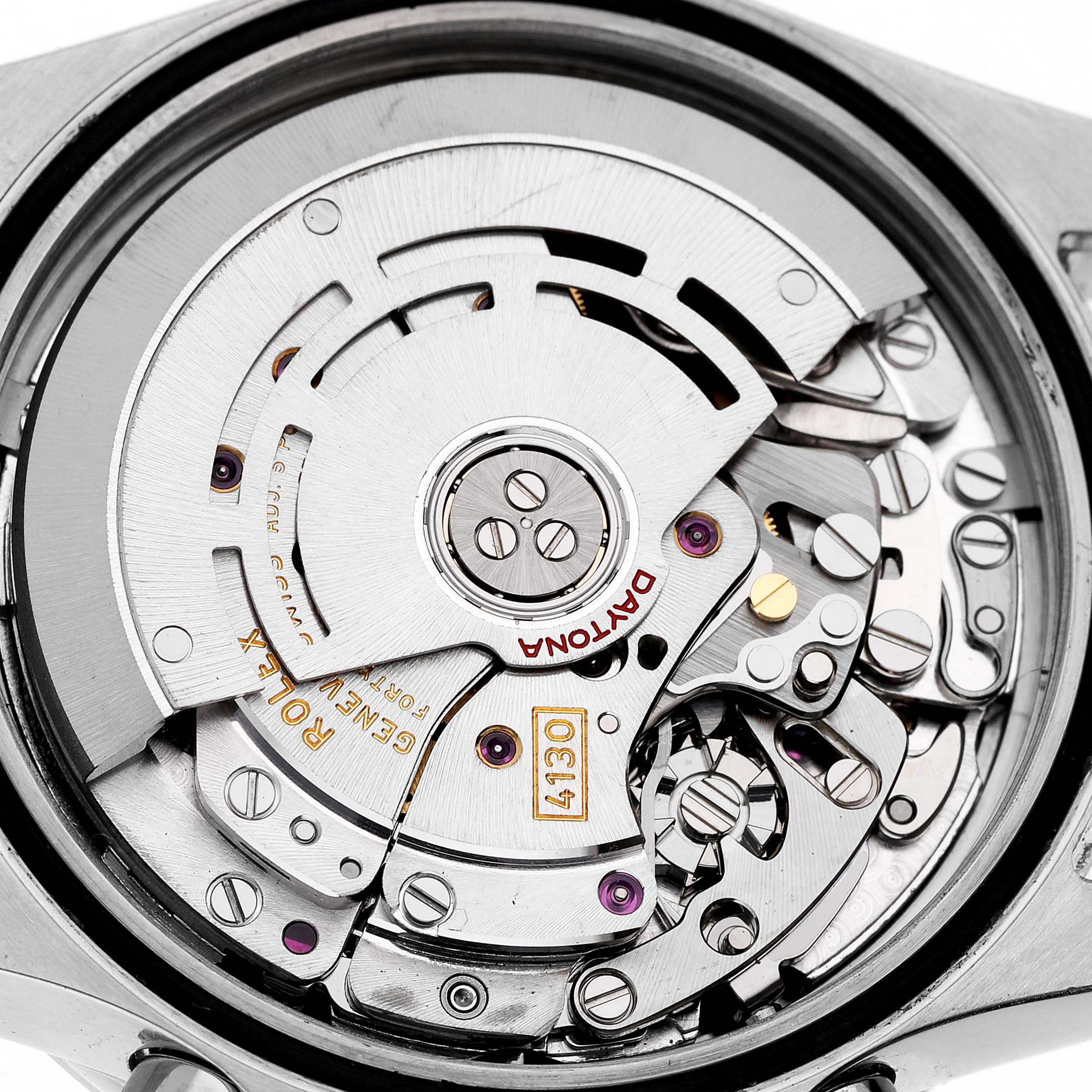 The image shows the movement of a Rolex Daytona 116520 Men's Stainless Steel White Dial, highlighting intricate gears and components from a top-down angle.